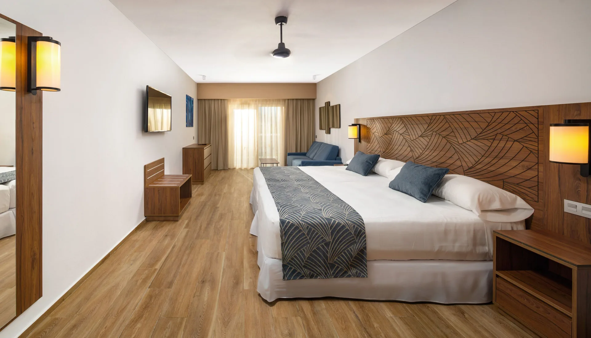 Family Room with two beds and seating area at Hotel Riu Montego Bay.