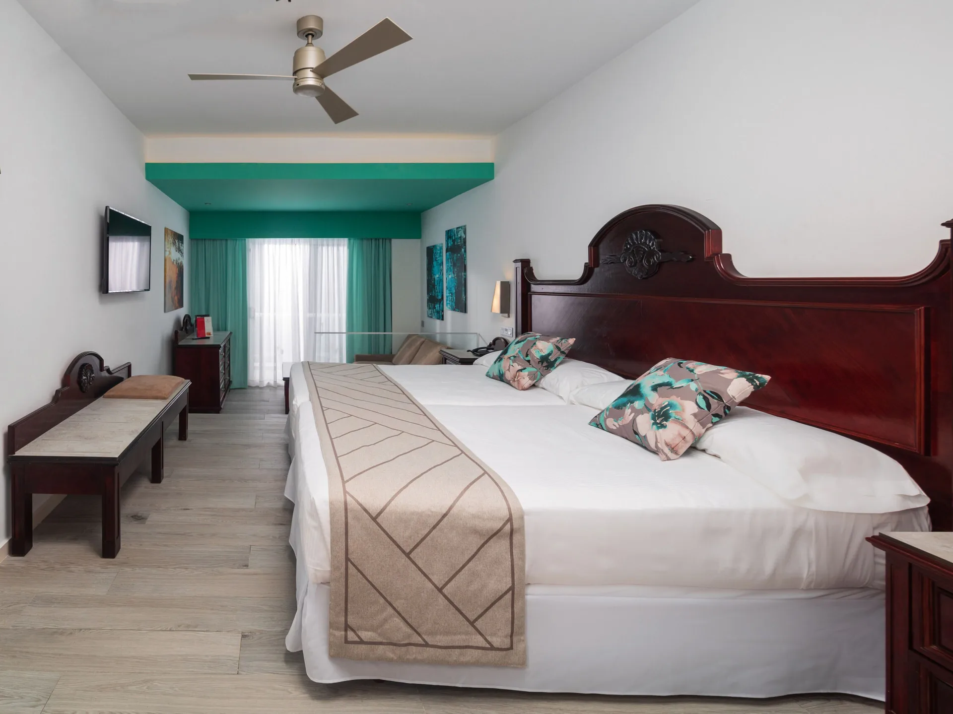 Junior Suite Oceanfront with king bed and balcony doors at Hotel Riu Ocho Rios.