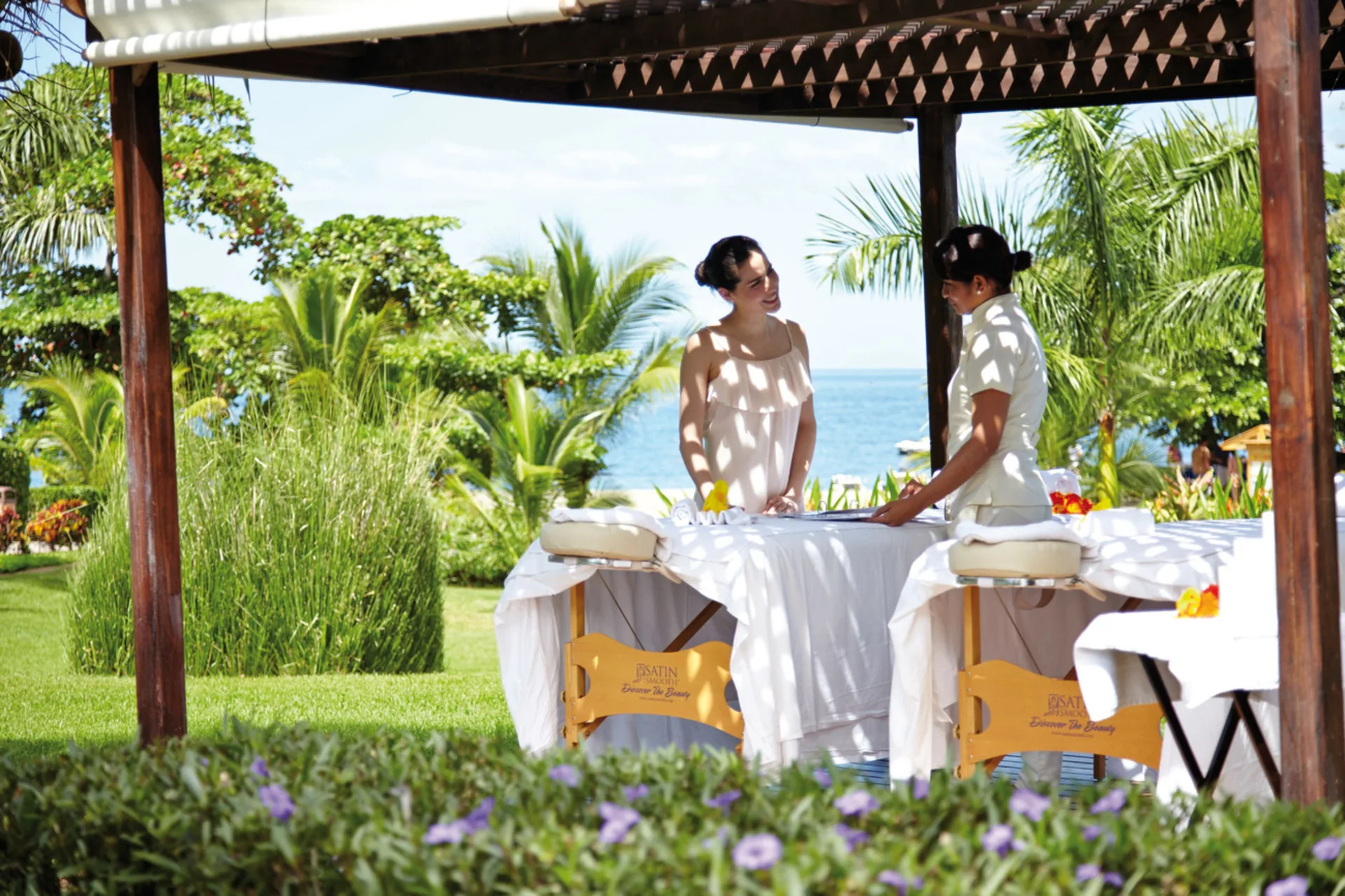 Outdoor massage tables under a garden pavilion at Hotel Riu Palace Costa Rica.
