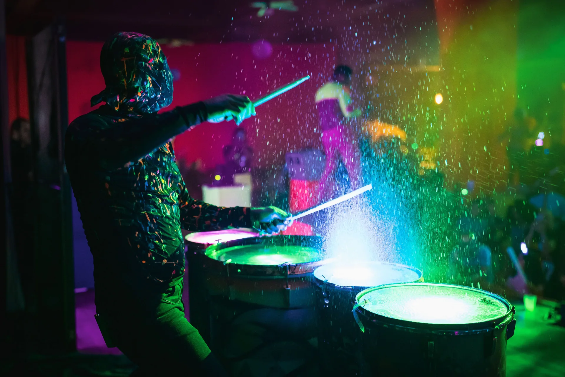 A drummer plays illuminated drums during a show at Hotel Riu Palace Costa Rica.