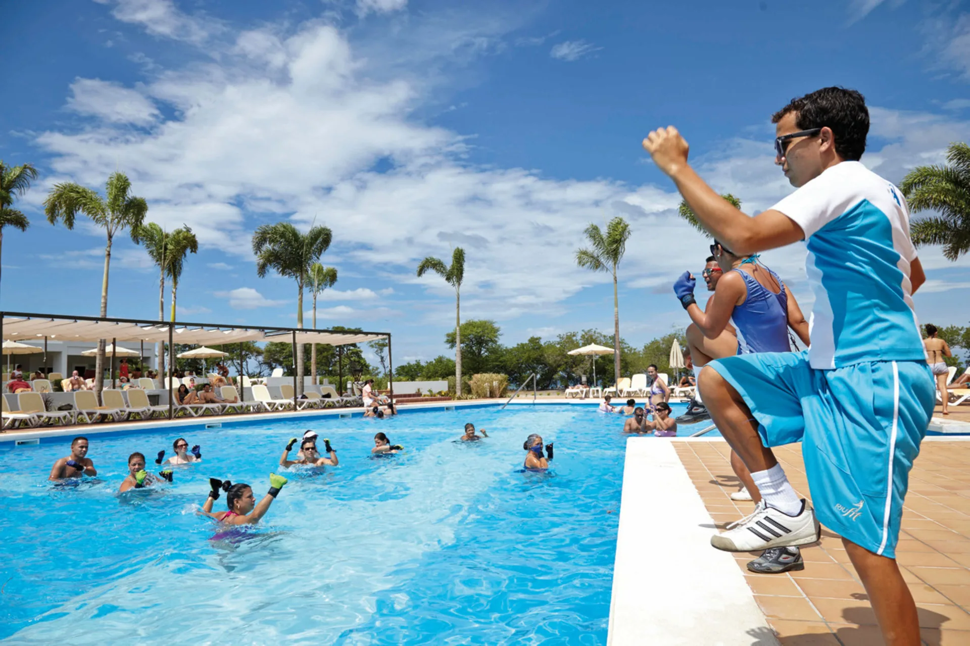 Pool fitness activity with instructors and guests at Hotel Riu Palace Costa Rica.