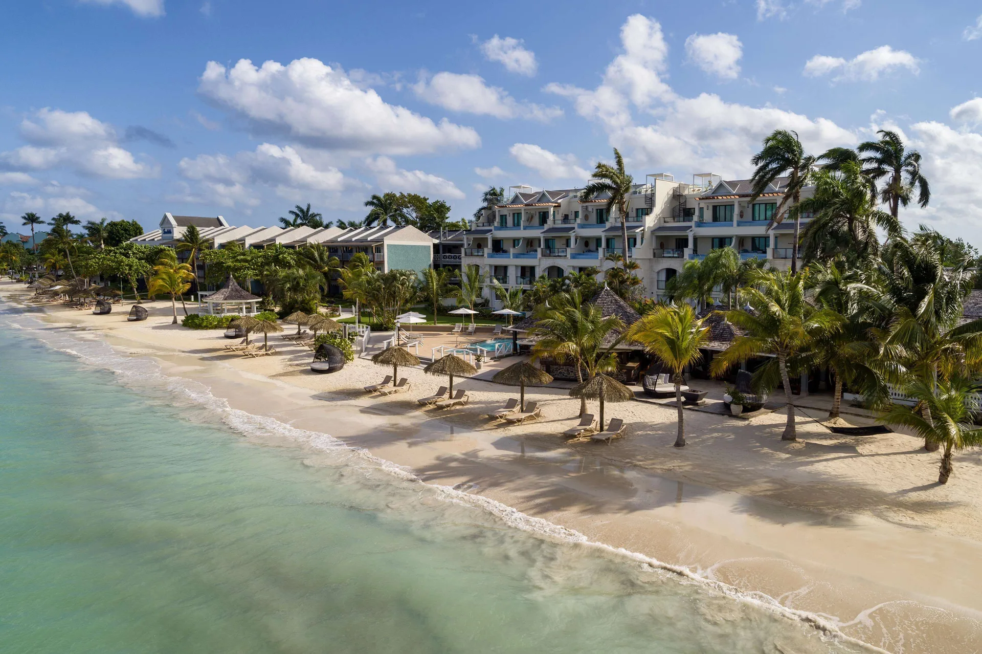 Sandals Negril adults-only couples resort on Seven Mile Beach Jamaica with turquoise waters and lush tropical gardens.