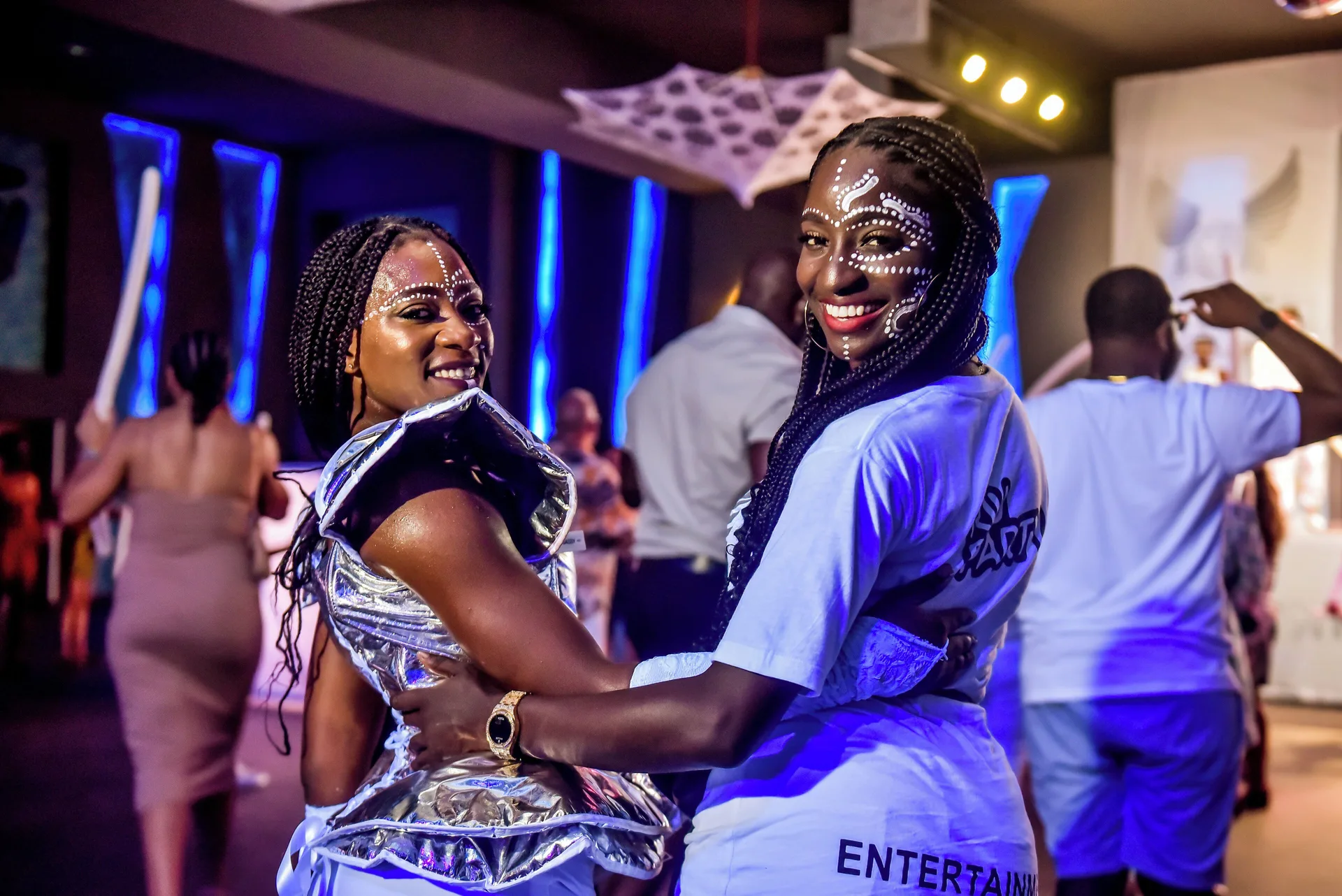 Smiling entertainers pose during an evening event at Hotel Riu Palace Tropical Bay.