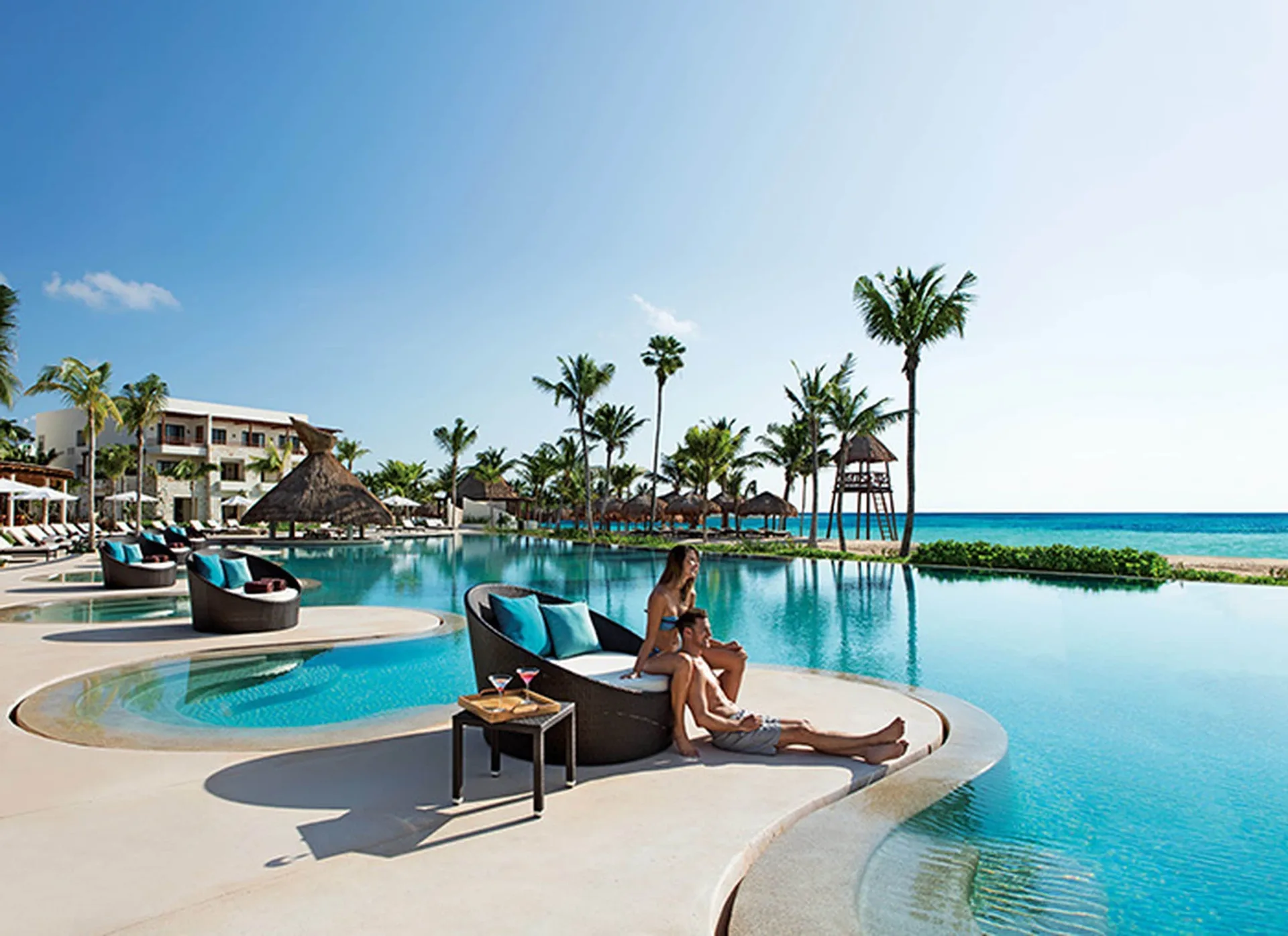 Hotel Xcaret Arte adults-only all-inclusive resort with beachfront pools and snorkeling setting