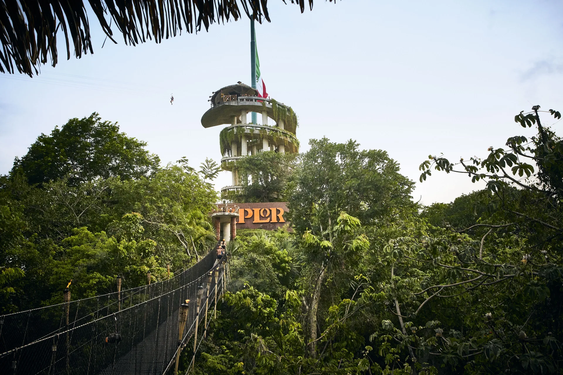Suspension bridge and jungle tower near Hotel Xcaret Arte.
