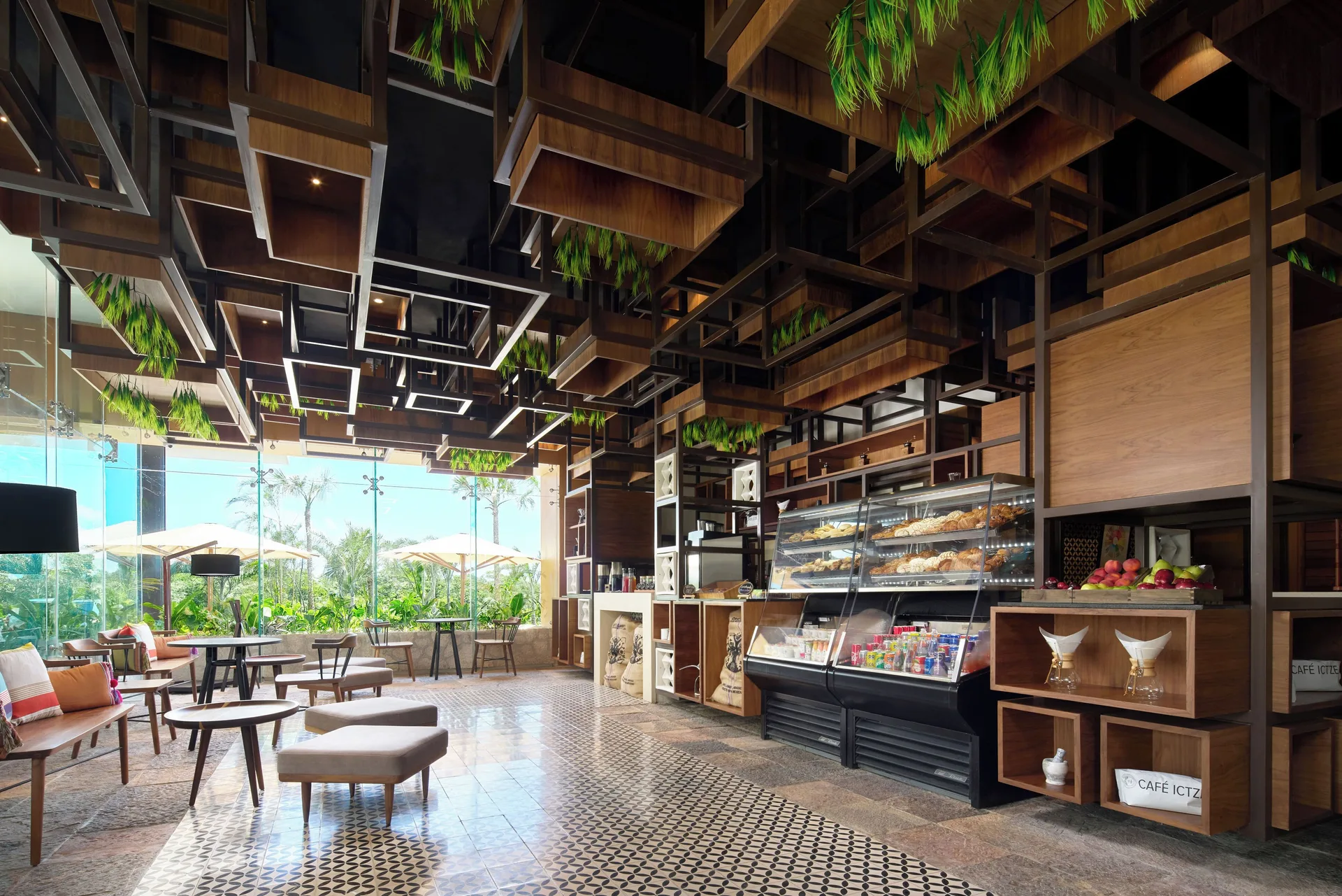 Cafe seating and pastry displays at Hotel Xcaret Arte.
