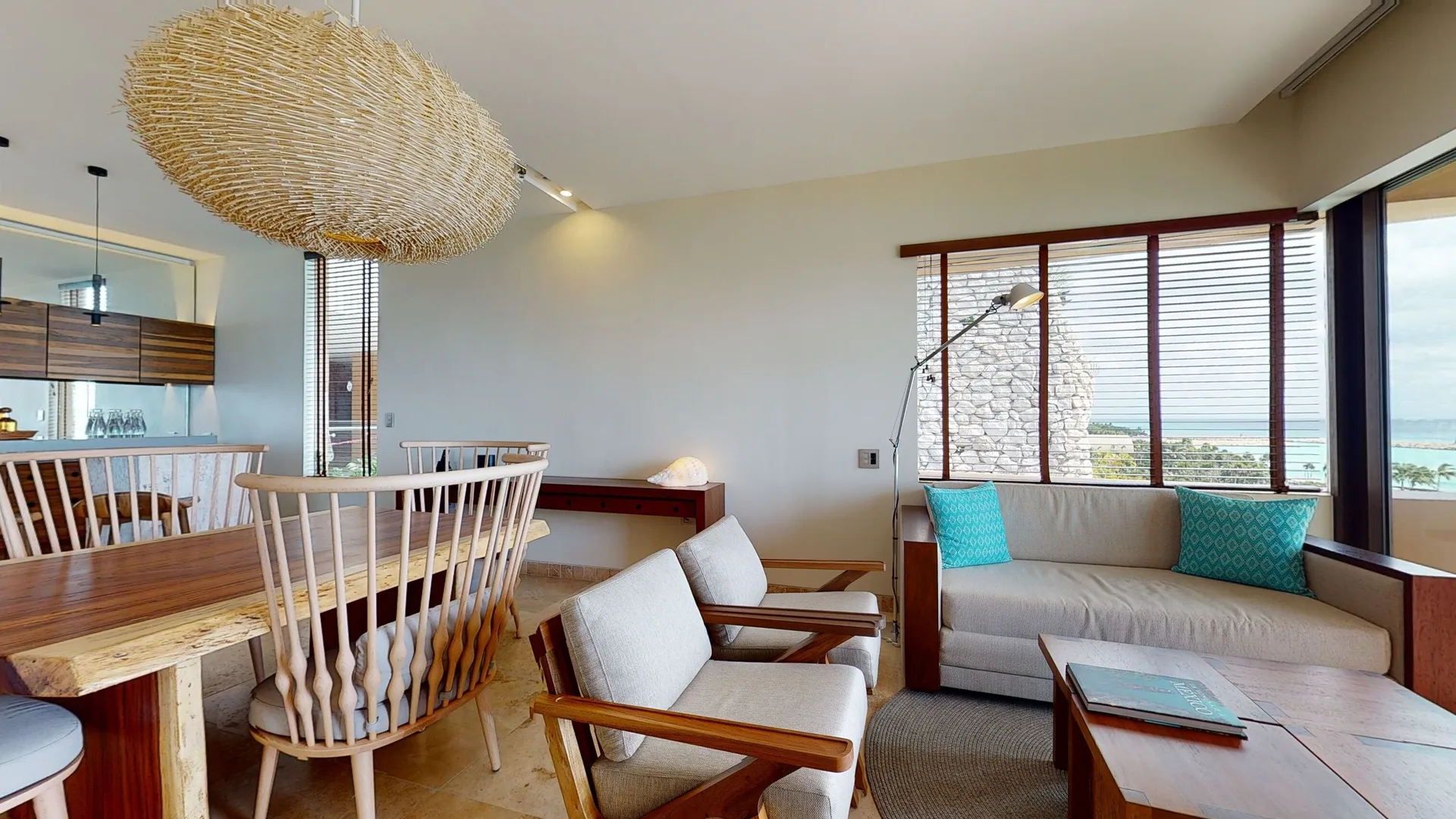 Oceanfront Junior Suite living and dining area with sea views at Hotel Xcaret Arte.