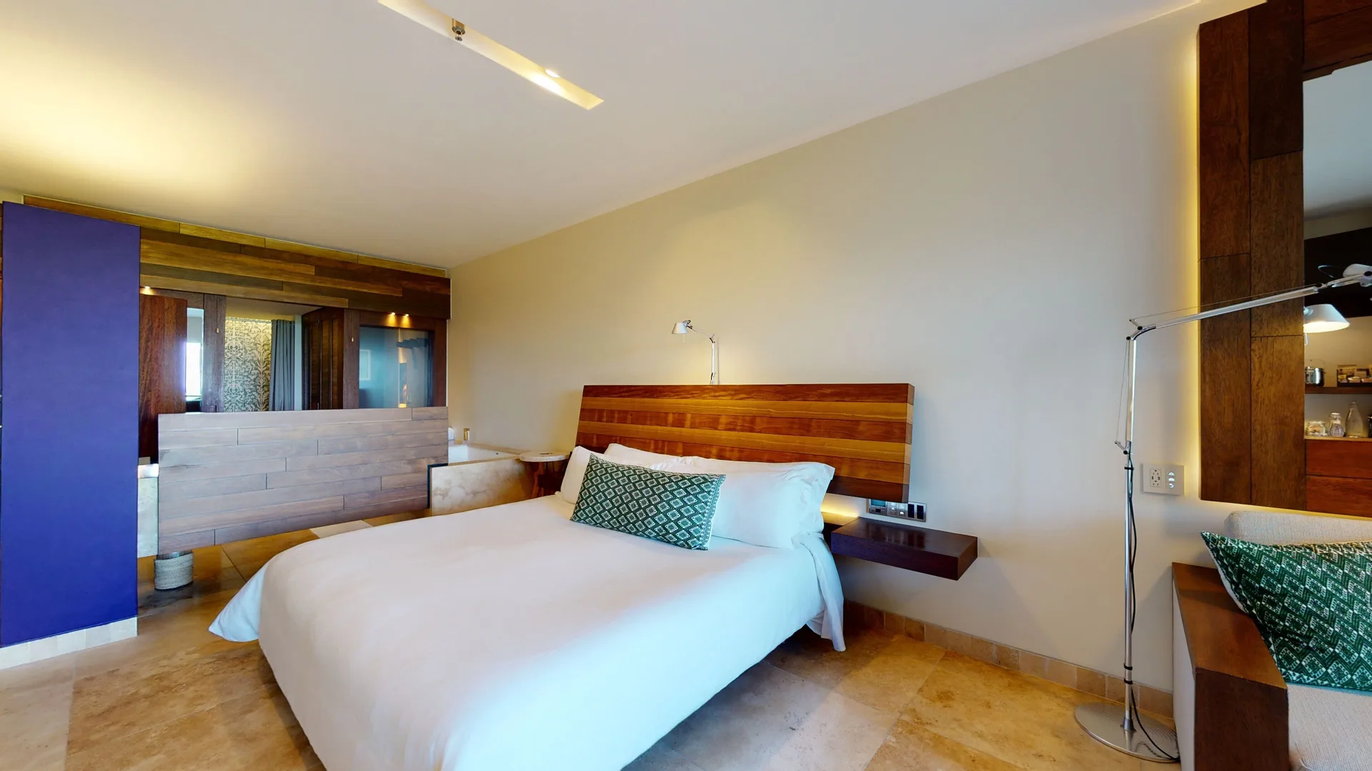 Ocean View suite bed and open bathroom area at Hotel Xcaret Arte.