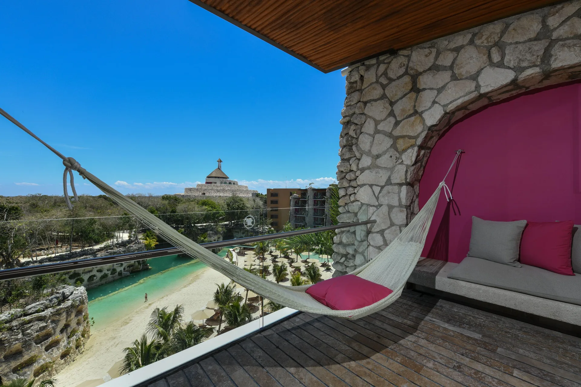 River suite terrace with hammock and cushioned seating at Hotel Xcaret Arte.