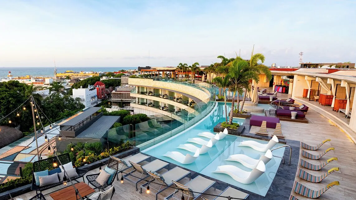 Rooftop pool deck and ocean view at Hyatt Centric Playa del Carmen - Downtown House & Beach House.