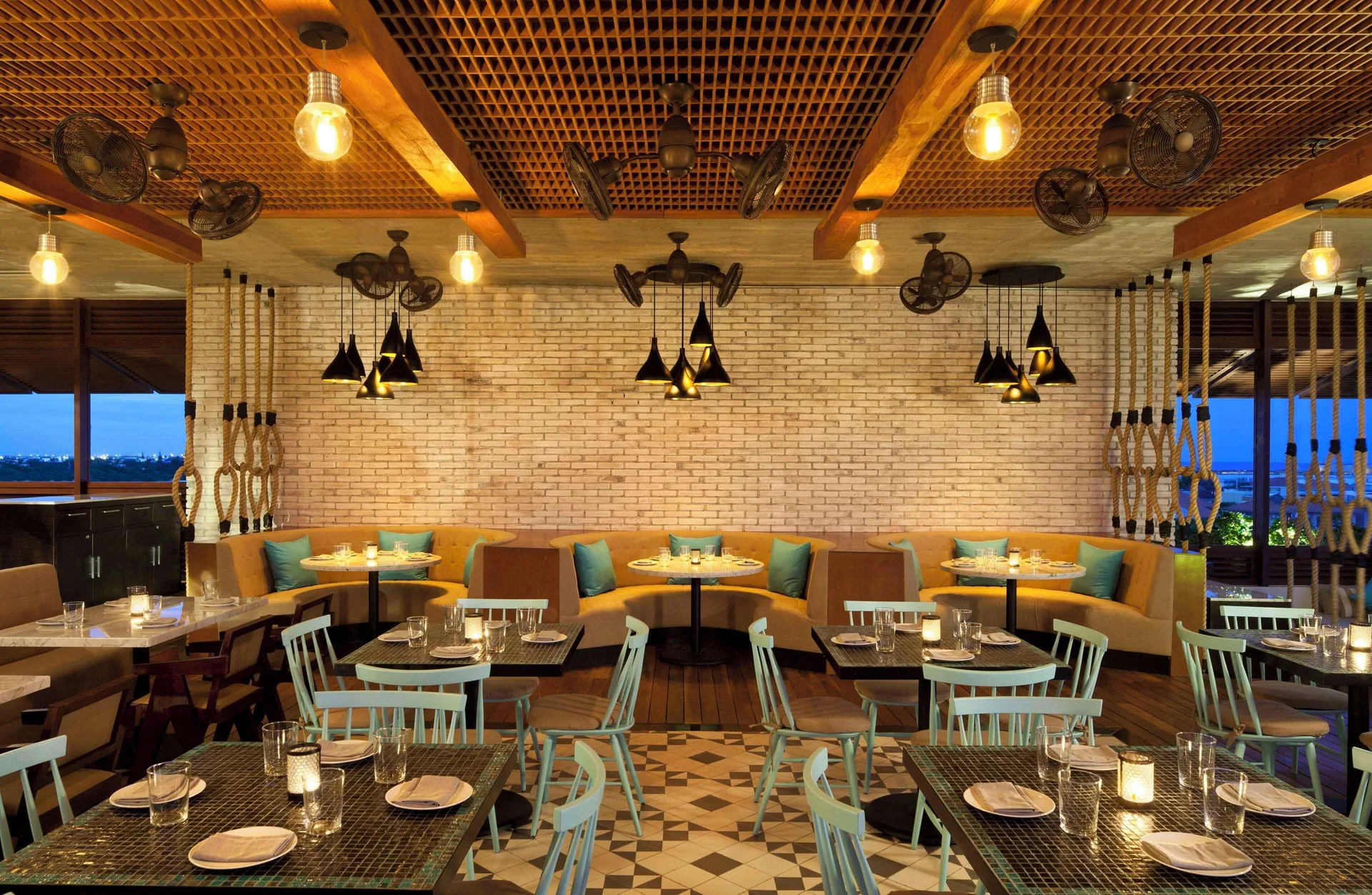 Warm dining room set for service at Hyatt Centric Playa del Carmen - Downtown House & Beach House.
