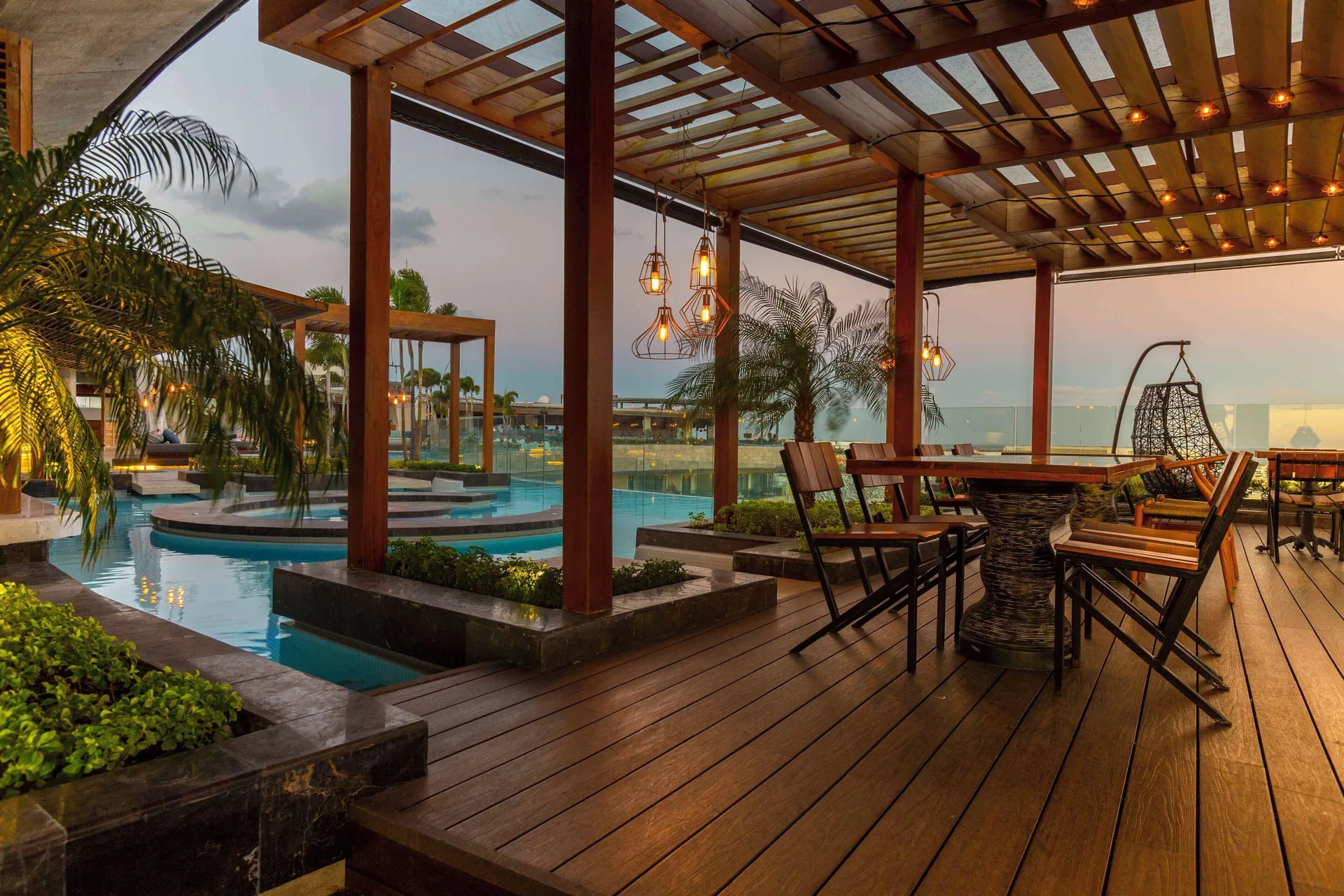 Poolside bar seating at Hyatt Centric Playa del Carmen - Downtown House & Beach House.