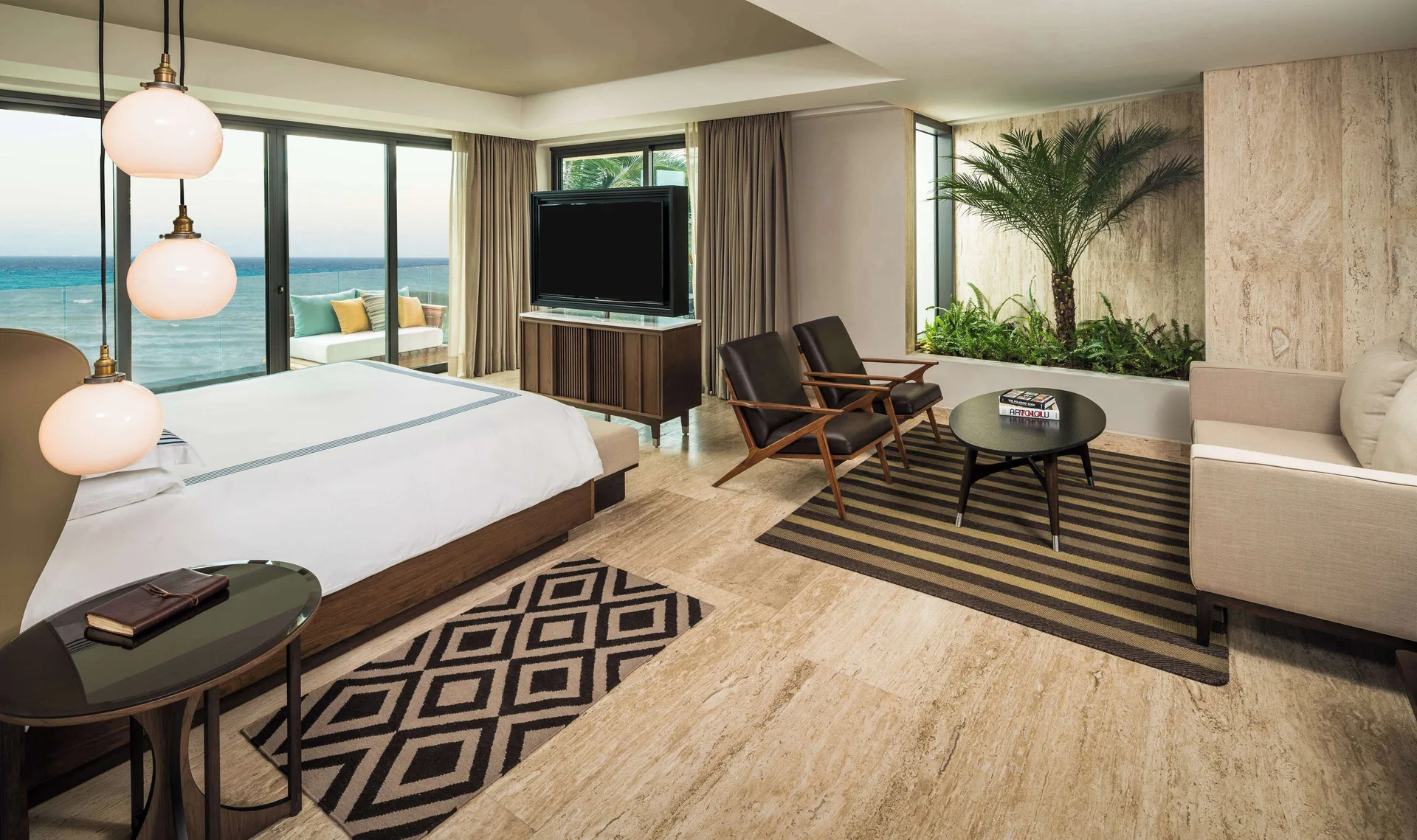 Beach House Suite Panoramic Ocean Front at Hyatt Centric Playa del Carmen with king bed, floor-to-ceiling windows, and unobstructed Caribbean Sea views.