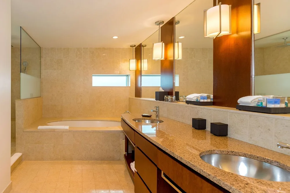 Guest bathroom with double vanity and soaking tub at Hyatt Regency Trinidad.