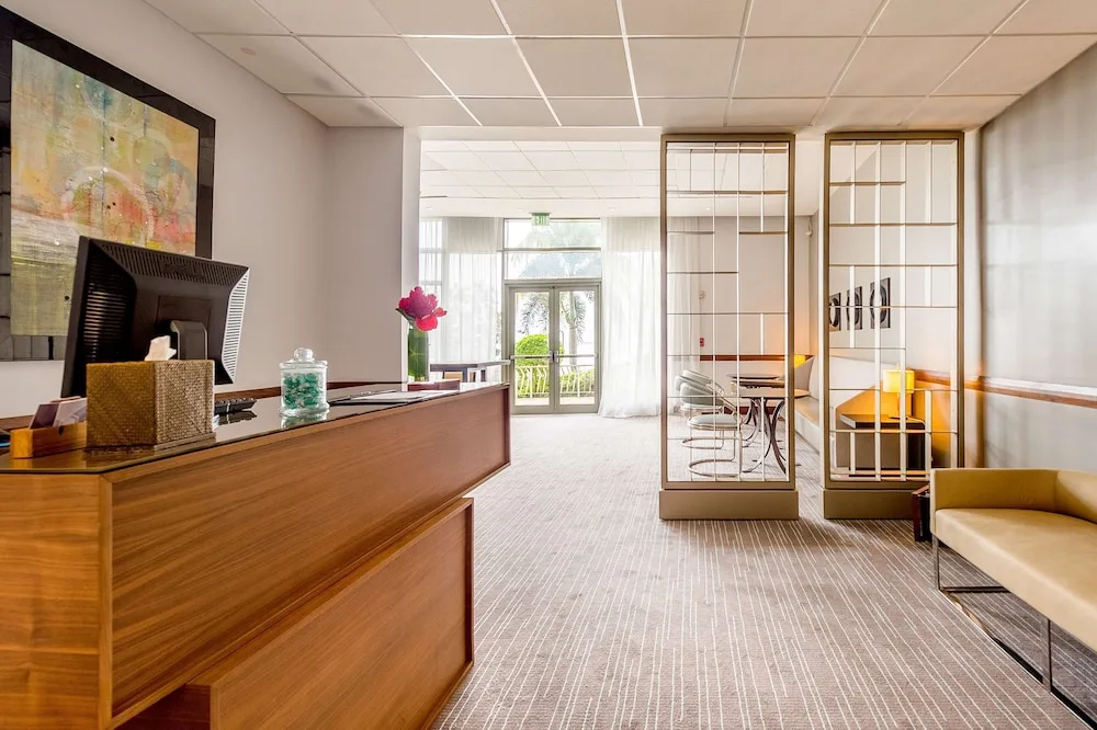 Reception desk and seating area in a quiet lounge at Hyatt Regency Trinidad.