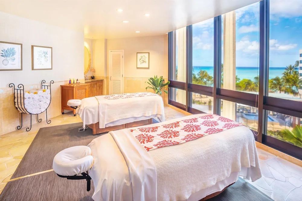Spa treatment room with two massage tables at Hyatt Regency Waikiki Beach Resort & Spa.