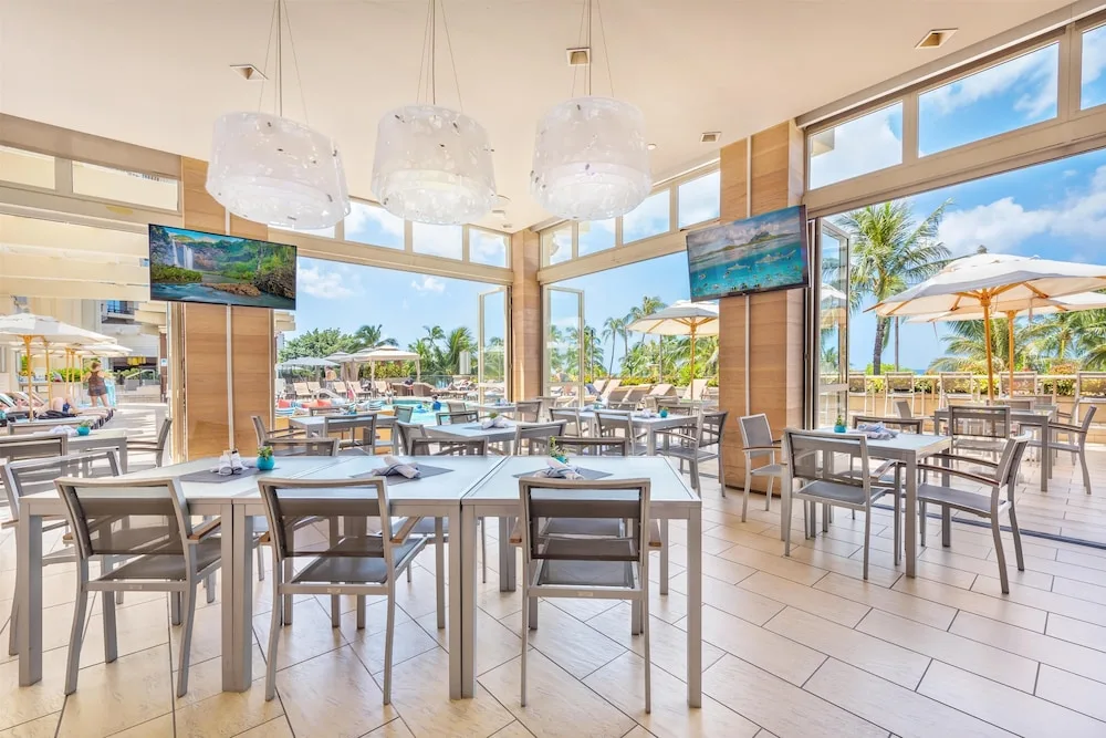 Open-air dining room near the pool at Hyatt Regency Waikiki Beach Resort & Spa.