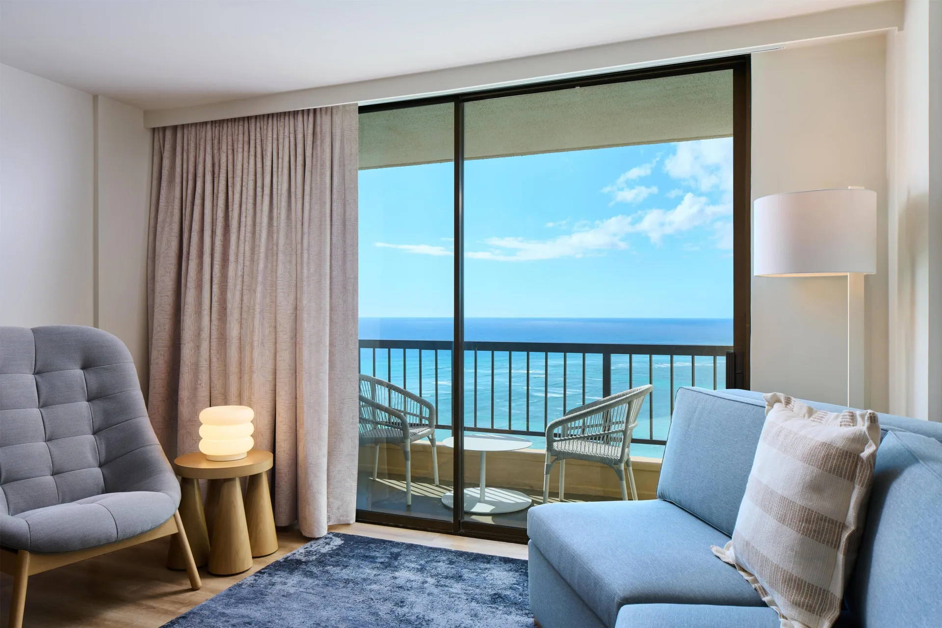 Junior Suite sitting area and oceanfront balcony at Hyatt Regency Waikiki Beach Resort & Spa.