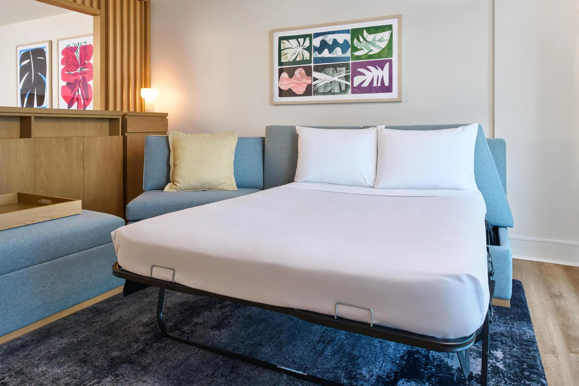 Junior suite sofa bed with pillows at Hyatt Regency Waikiki Beach Resort & Spa.