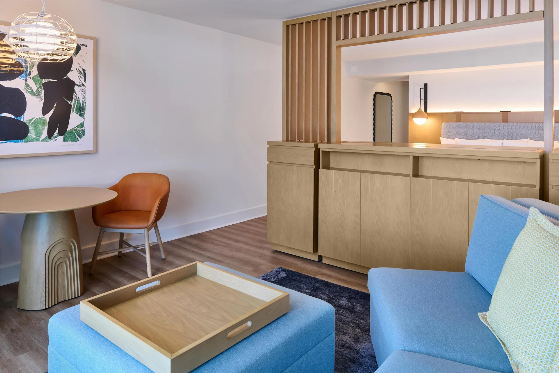 Junior Suite lounge with sofa bed and dining table at Hyatt Regency Waikiki Beach Resort & Spa.