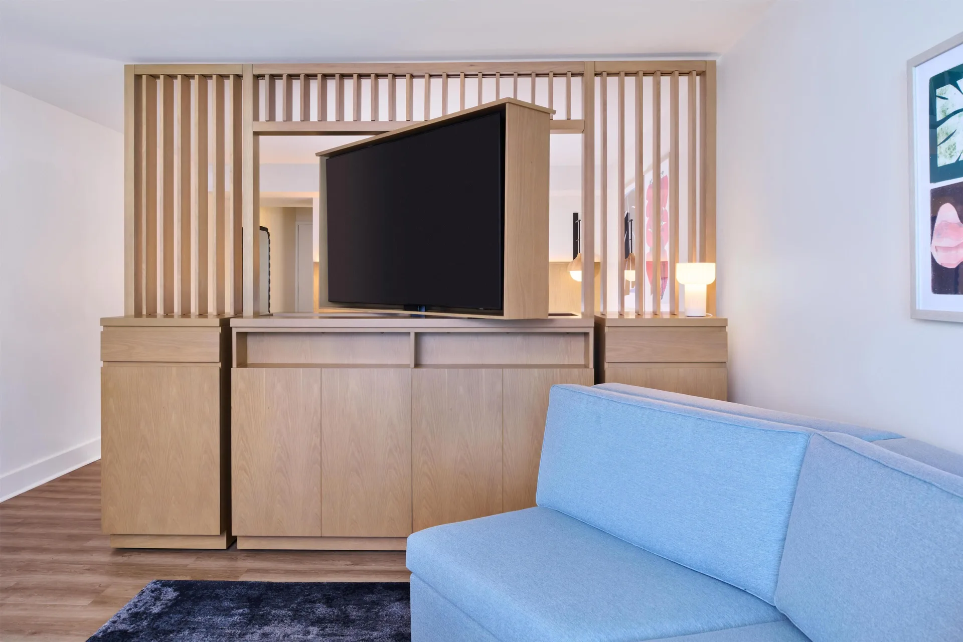 Junior Suite sofa bed and TV divider at Hyatt Regency Waikiki Beach Resort & Spa.