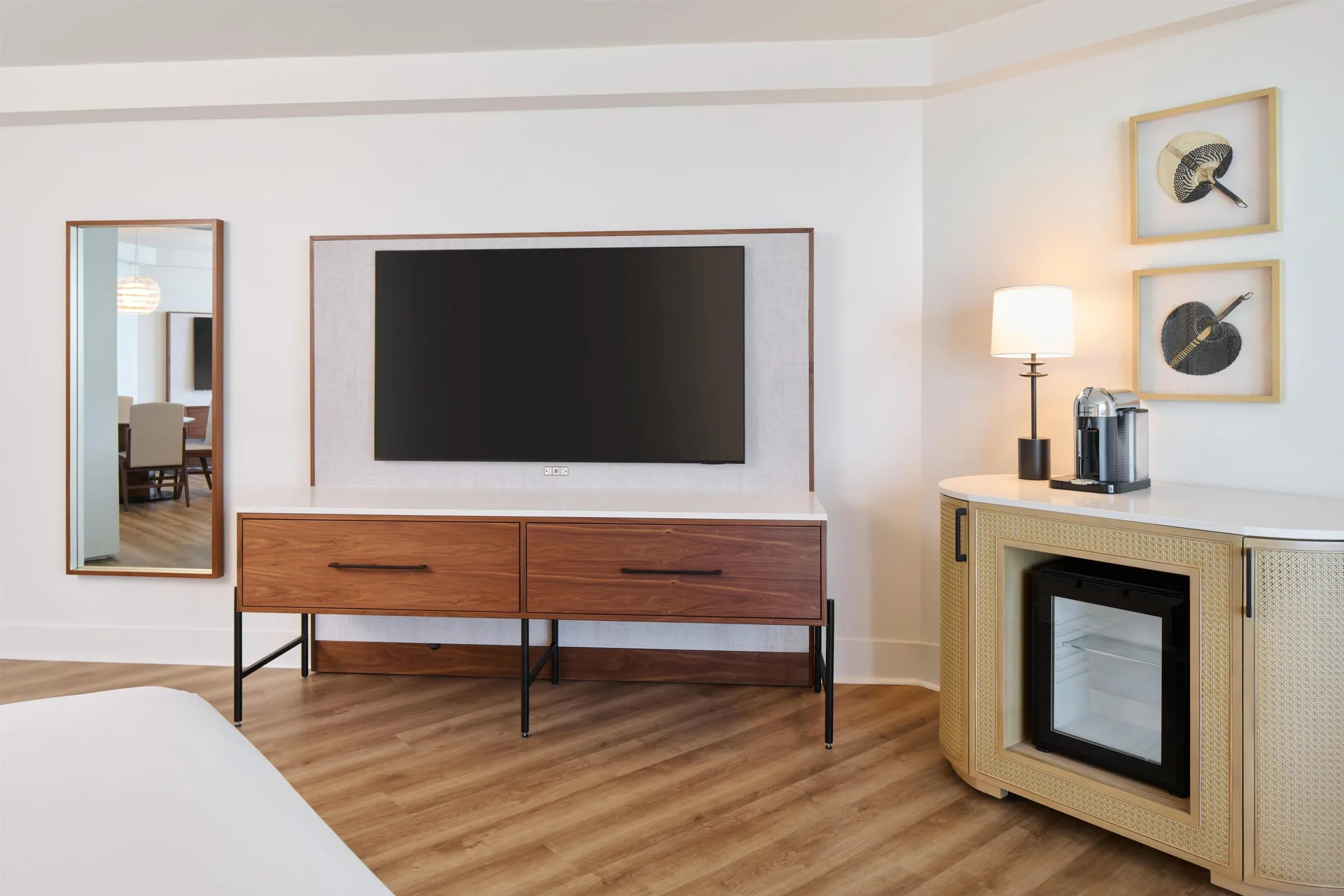 Guest room TV wall and refreshment cabinet in an ocean front suite at Hyatt Regency Waikiki Beach Resort & Spa.