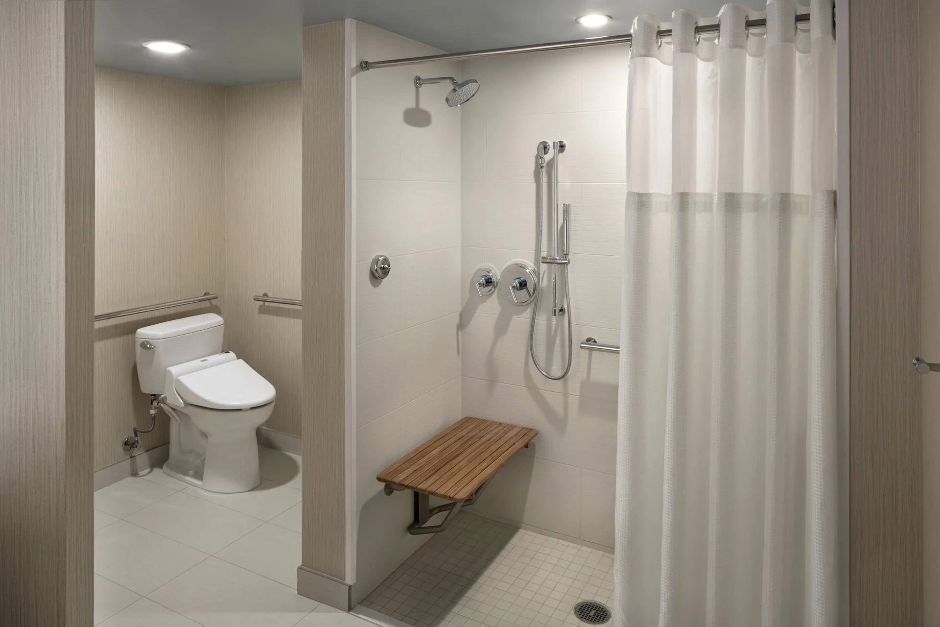 Accessible room bathroom with roll-in shower at Hyatt Regency Waikiki Beach Resort & Spa.