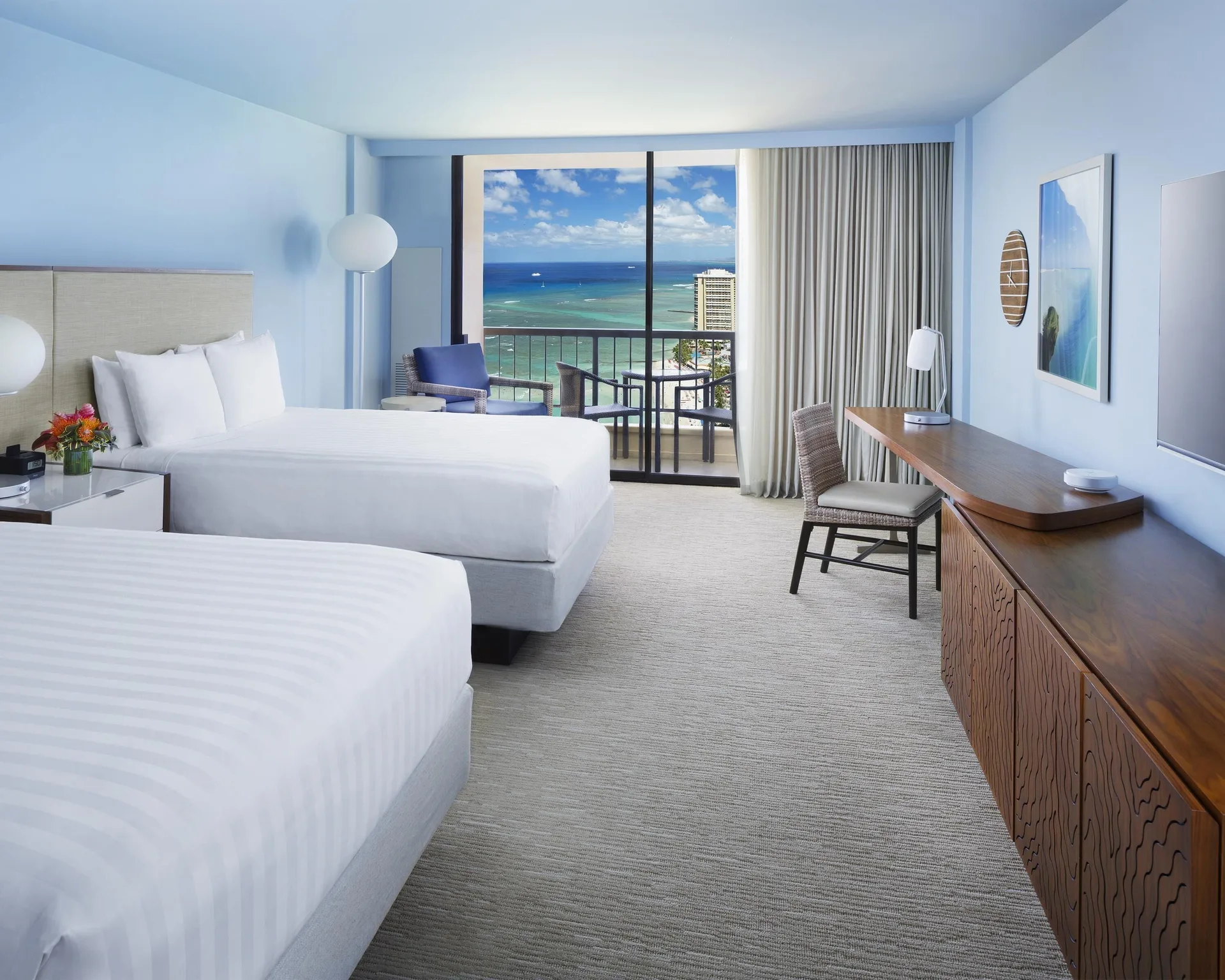 Two bed Ocean View room at Hyatt Regency Waikiki Beach Resort & Spa with desk and balcony.