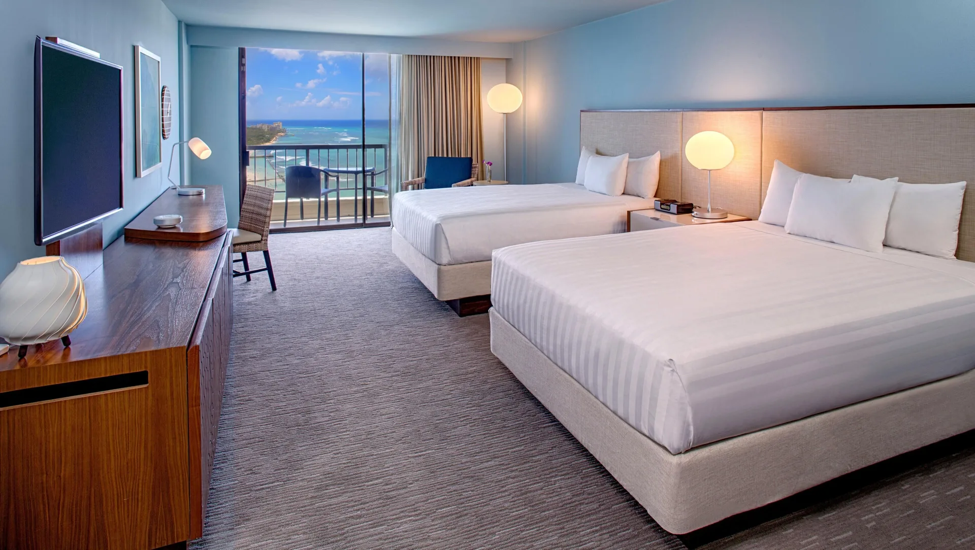 Oceanfront room with two beds and balcony at Hyatt Regency Waikiki Beach Resort & Spa.
