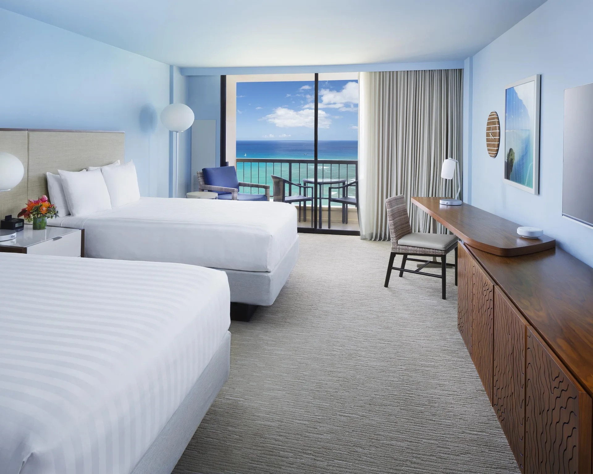 Two-bed oceanfront guest room with balcony at Hyatt Regency Waikiki Beach Resort & Spa.