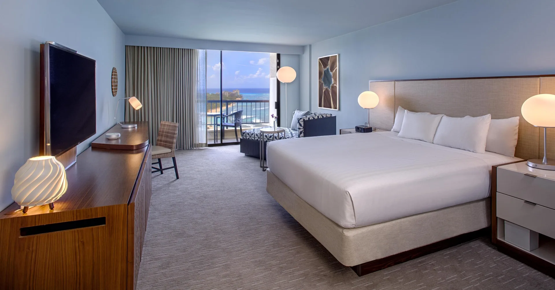 King oceanfront room with chaise and balcony at Hyatt Regency Waikiki Beach Resort & Spa.