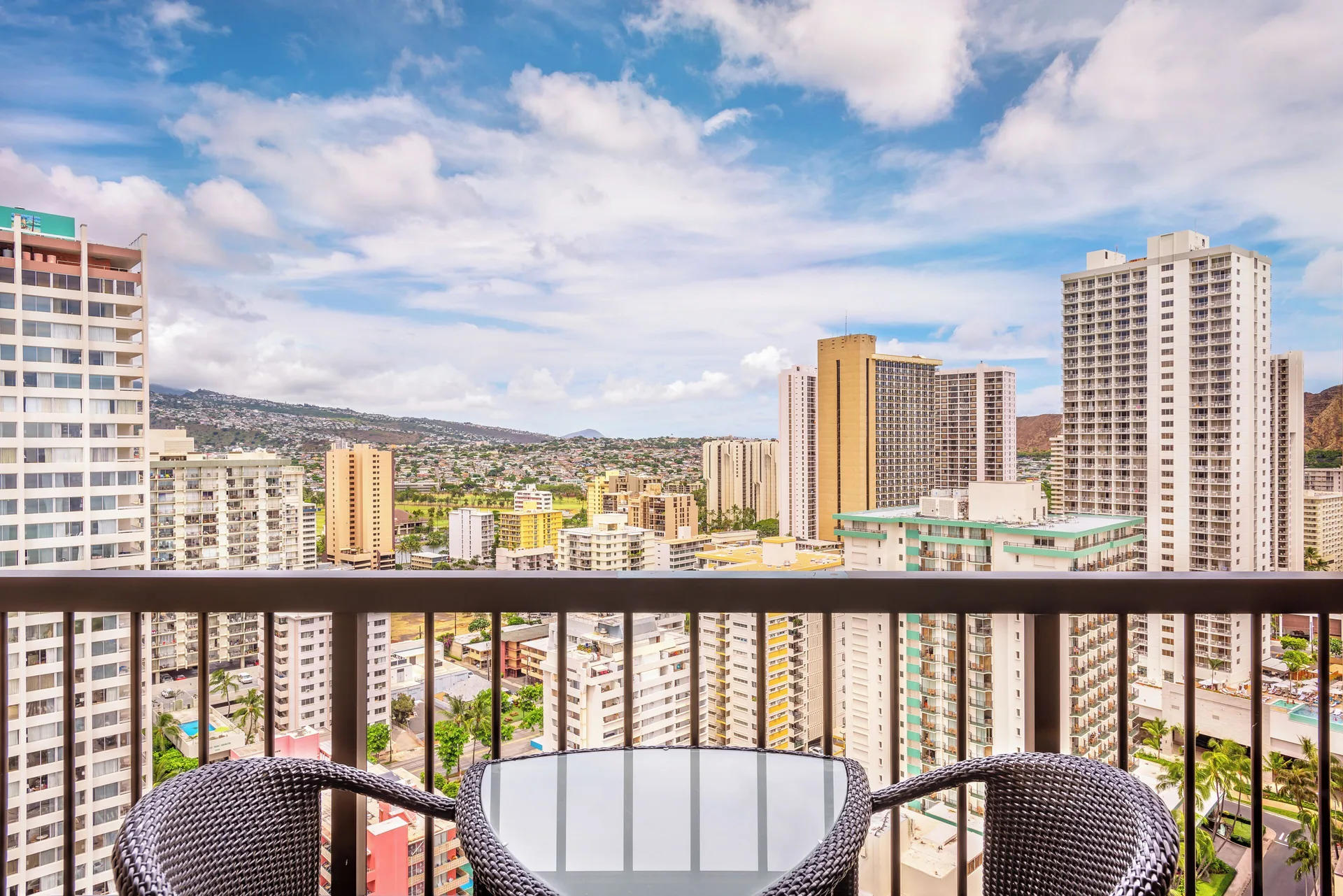 Balcony seating with Waikiki city views at Hyatt Regency Waikiki Beach Resort & Spa.