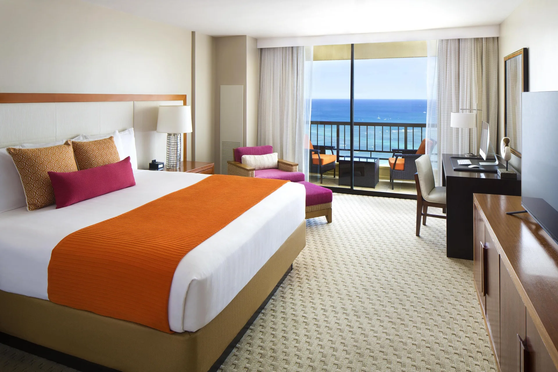 Two Bedroom Ambassador Suite king bedroom at Hyatt Regency Waikiki Beach Resort & Spa with ocean-view balcony.