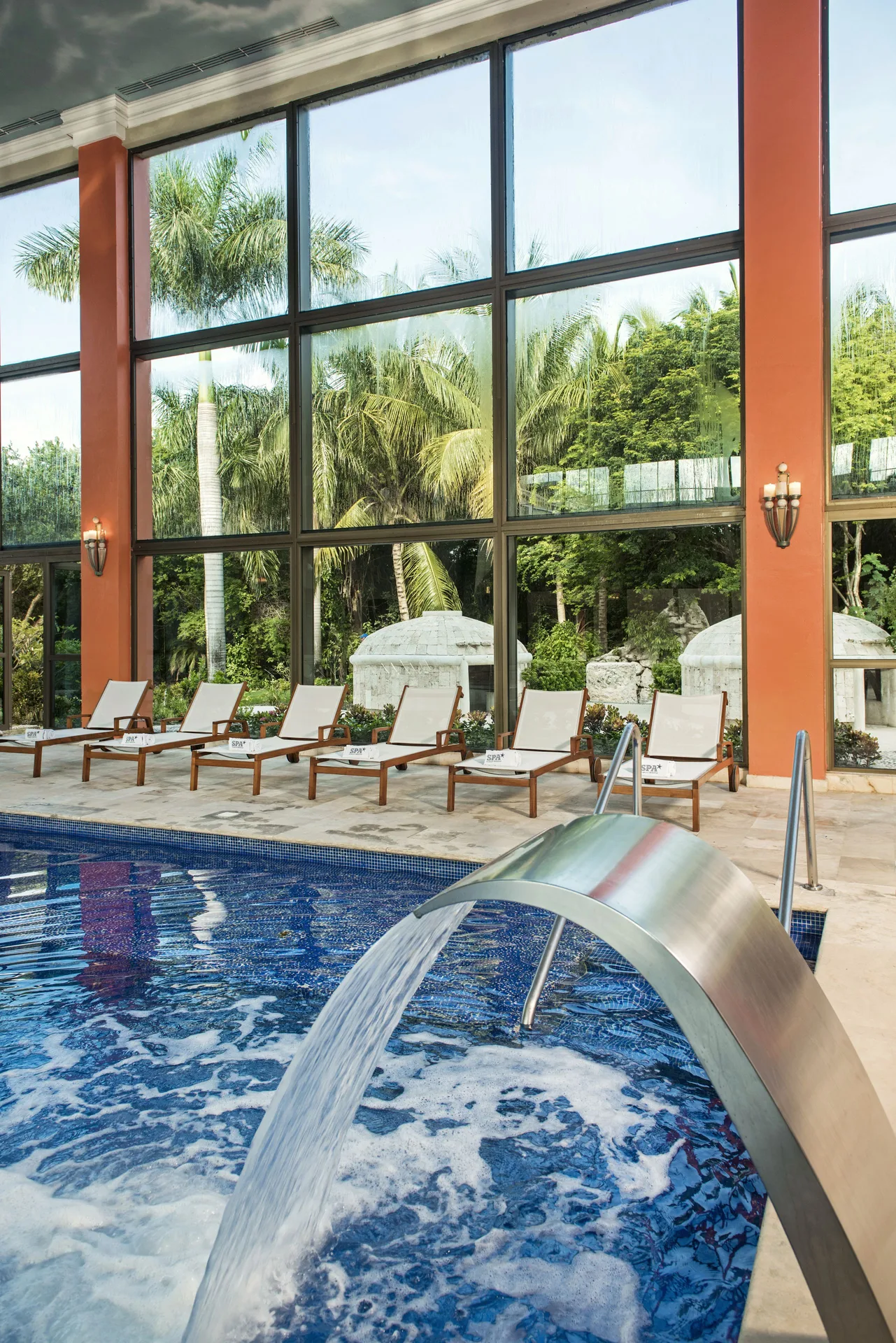 Spa pool water feature beside loungers at Iberostar Waves Paraíso del Mar.