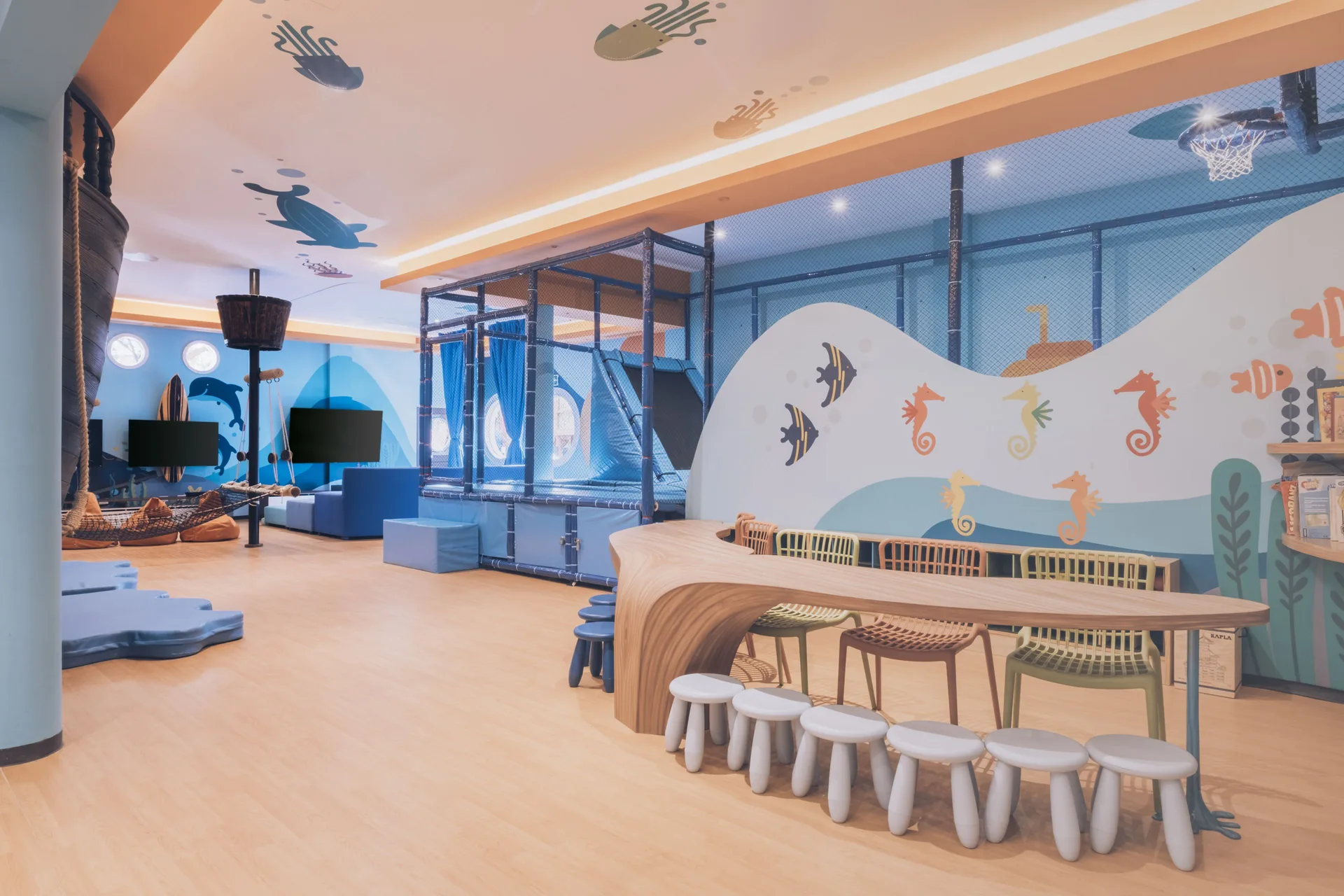 Underwater-themed kids’ play area with tables at Iberostar Waves Paraíso del Mar.