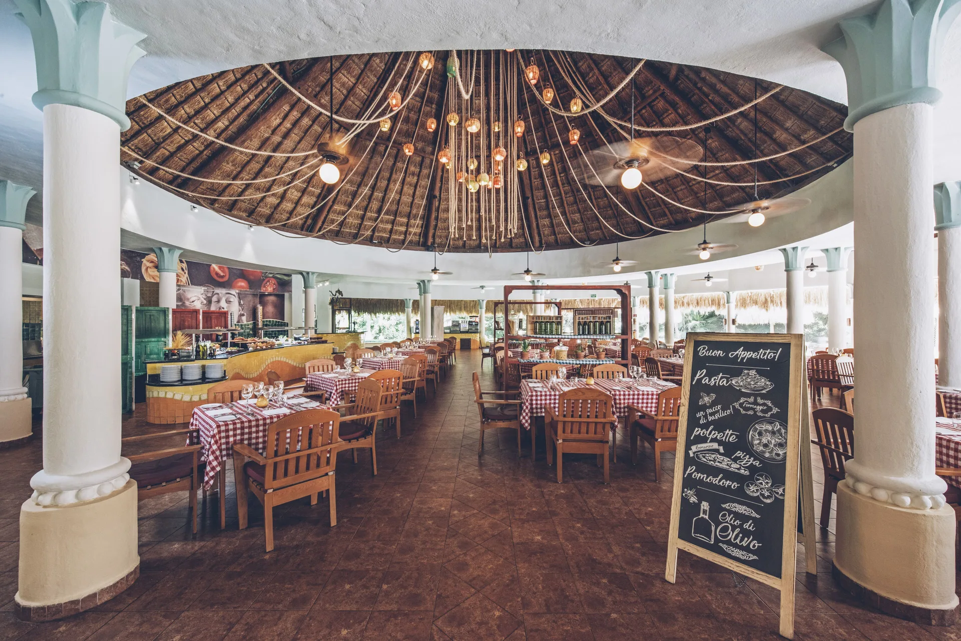 Italian restaurant dining room with buffet and chalkboard at Iberostar Waves Paraíso del Mar.