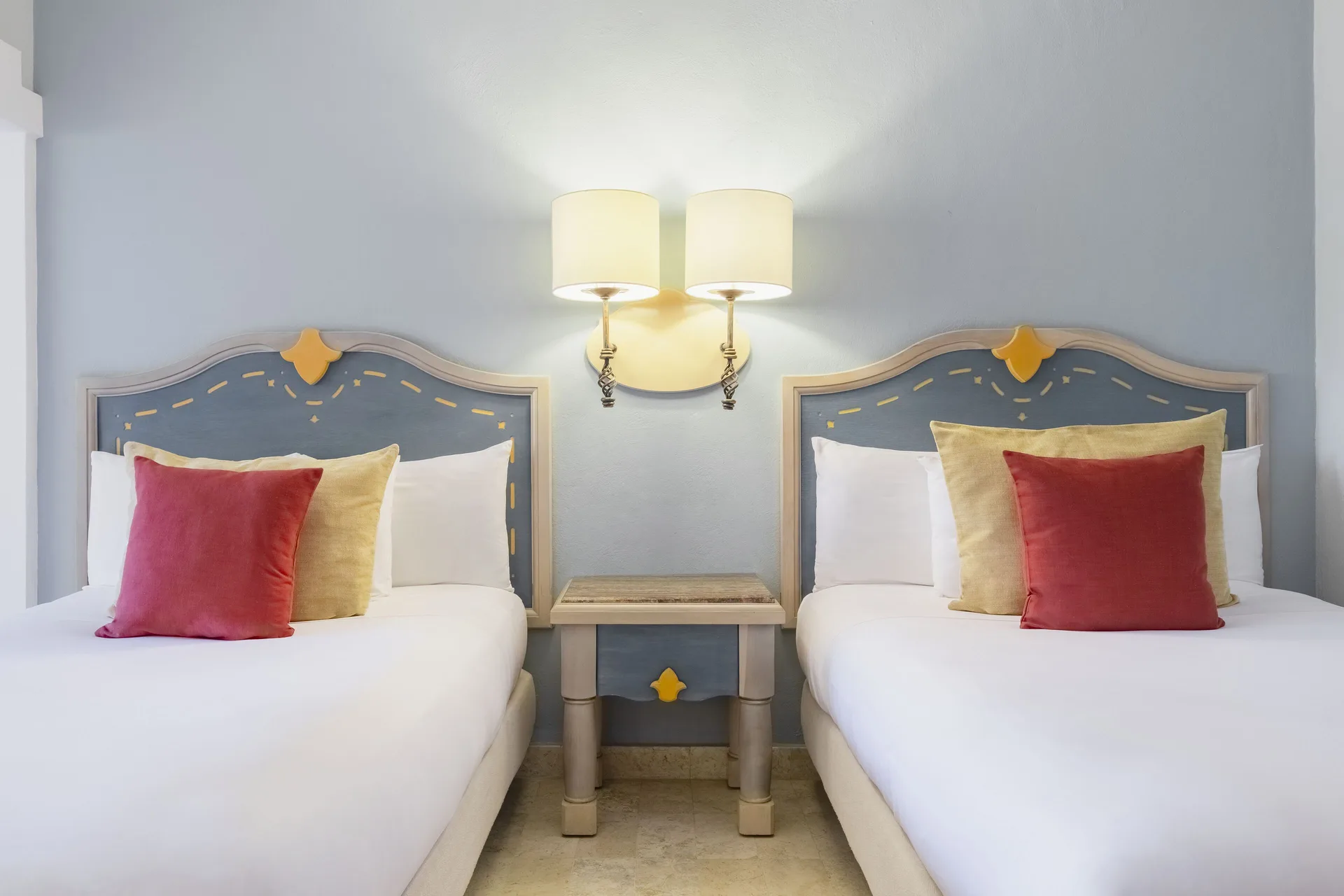 Premium Room two beds with blue headboards at Iberostar Waves Paraíso del Mar.