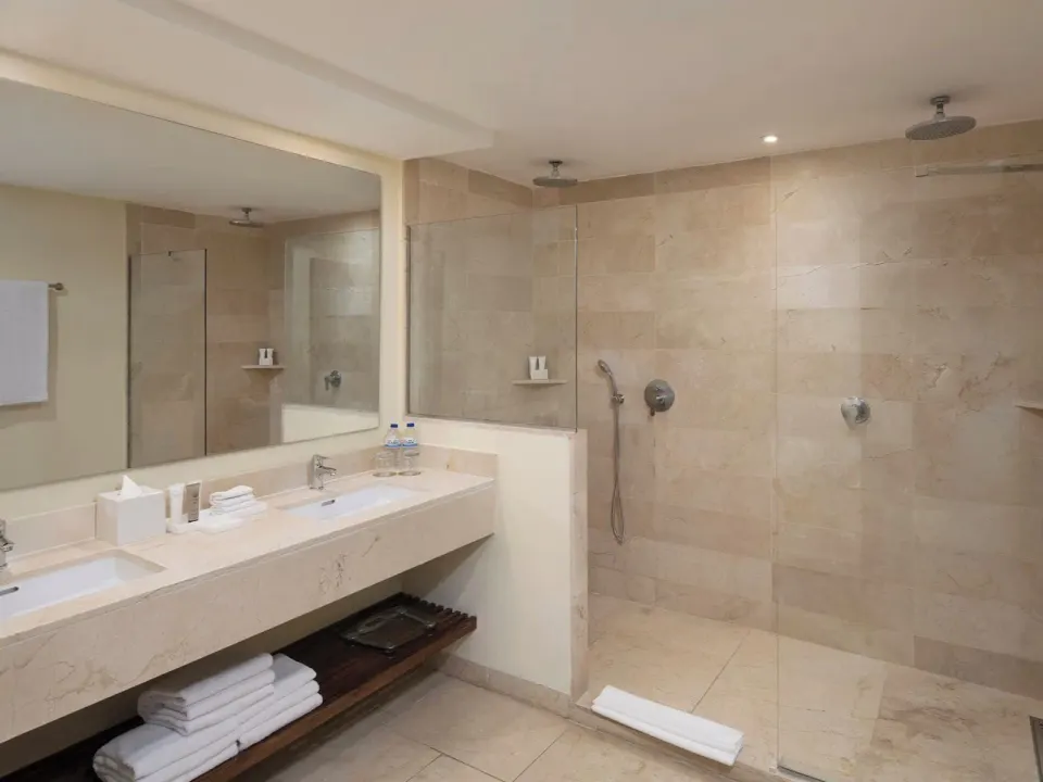 Junior Suite Premium Pool View bathroom with double vanity at Impressive Premium Punta Cana.