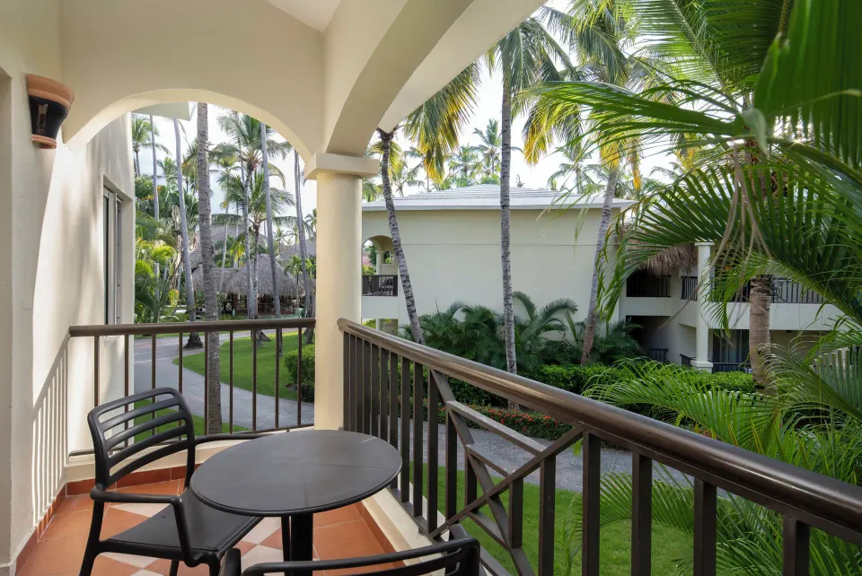 Tropical-view balcony of a Junior Suite at Impressive Premium Punta Cana.