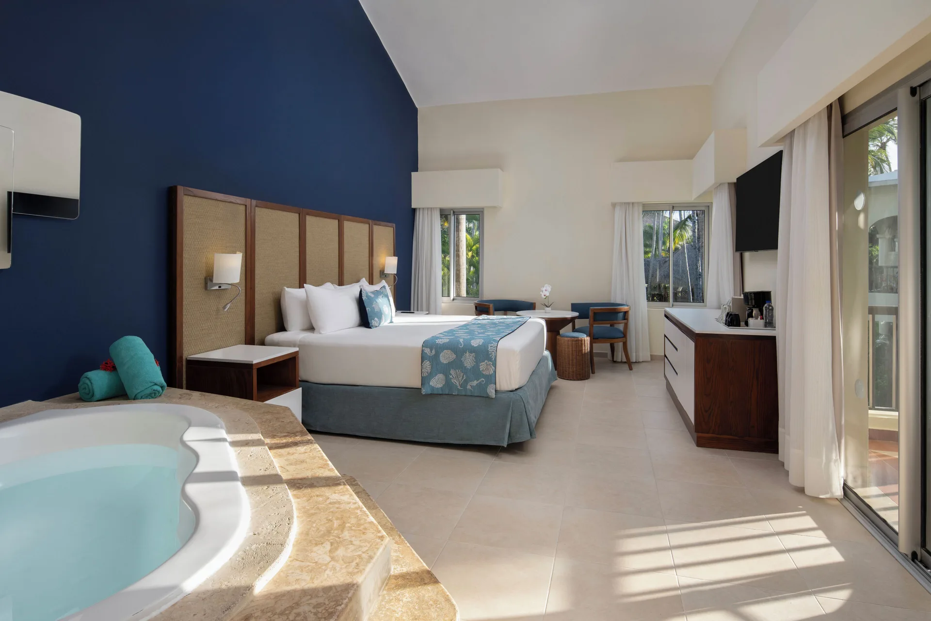Junior Suite Premium Tropical View with Jacuzzi bedroom at Impressive Premium Punta Cana.