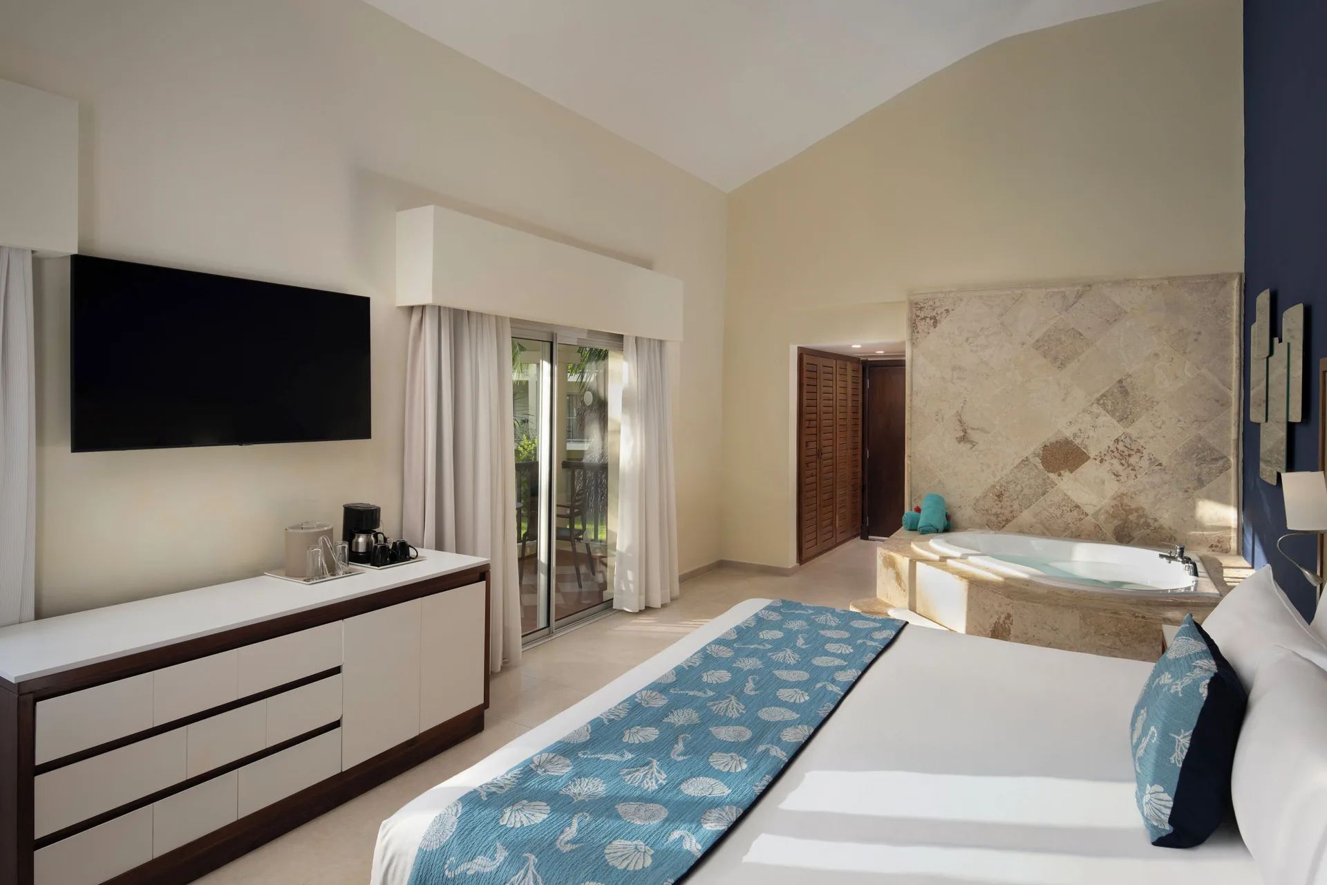 Junior Suite Premium Tropical View with Jacuzzi and TV at Impressive Premium Punta Cana.