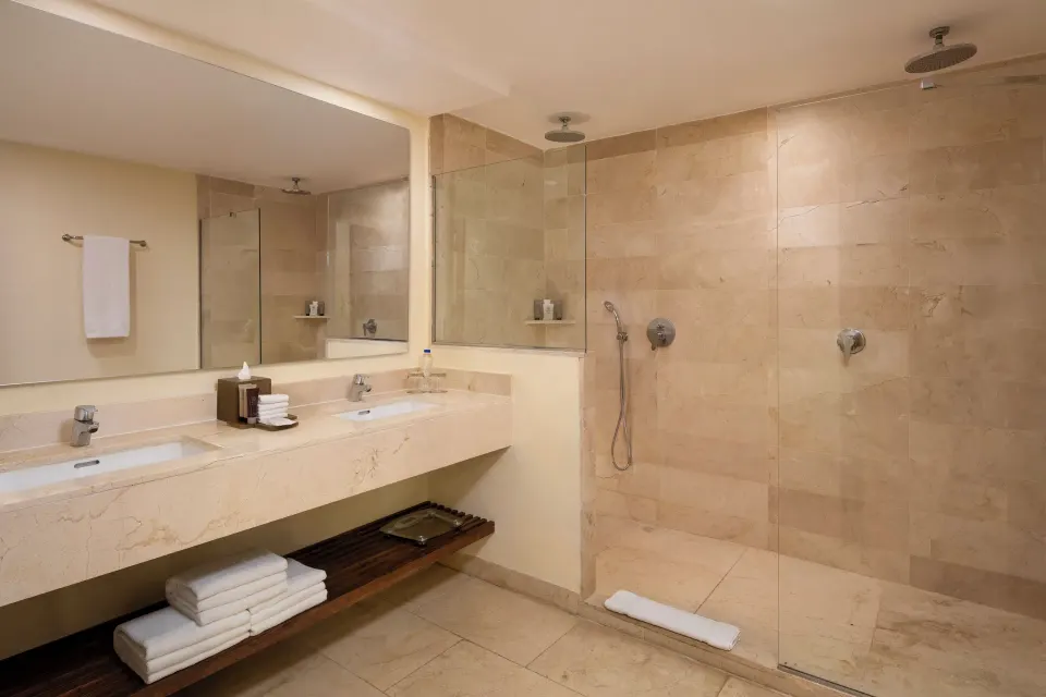 Junior Suite Premium Tropical View bathroom with double vanity at Impressive Premium Punta Cana.