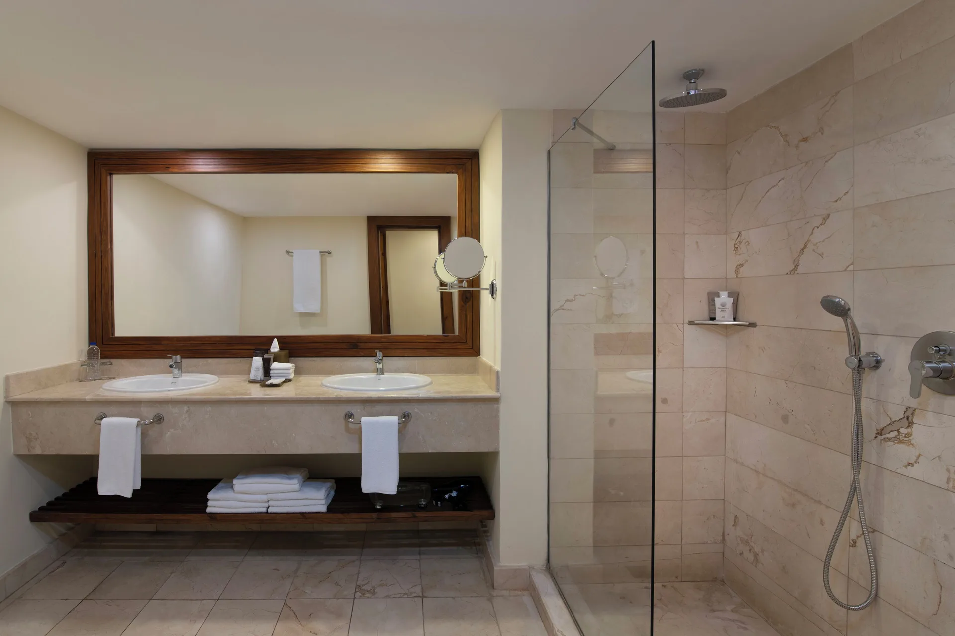 Junior Suite Premium Tropical View bathroom with glass shower at Impressive Premium Punta Cana.