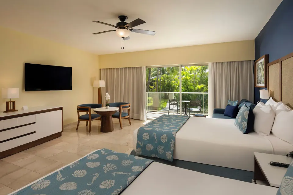 Junior Suite Premium Tropical View with two beds and balcony at Impressive Premium Punta Cana.
