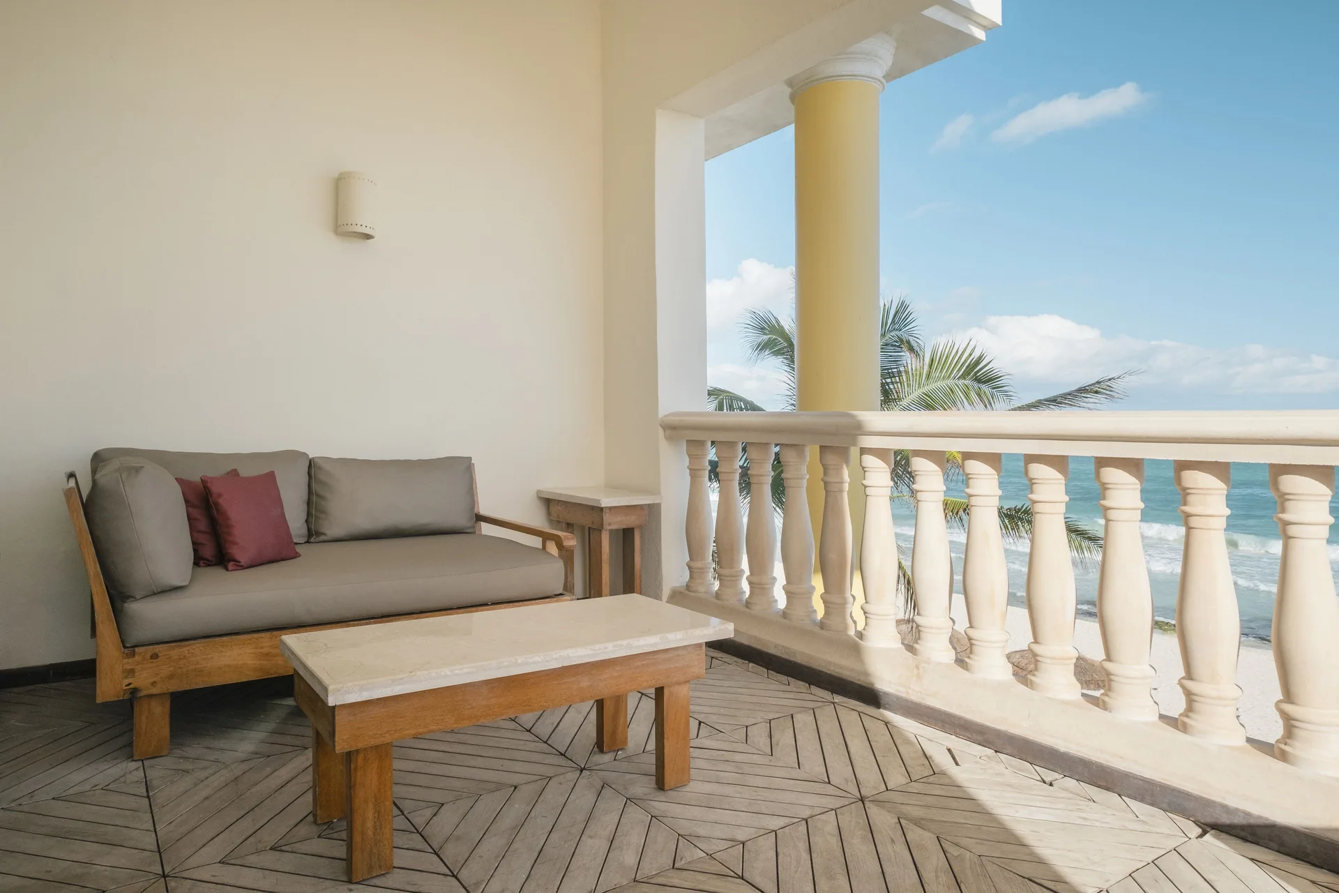 Oceanfront suite balcony lounge seating with sea view at JOIA Paraíso by Iberostar.