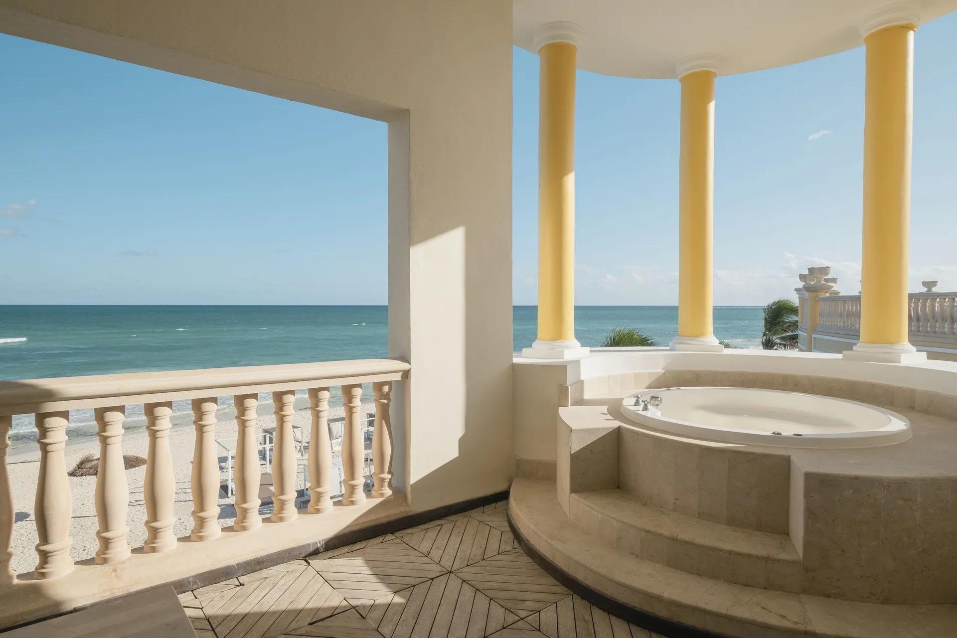 Oceanfront suite balcony with outdoor tub and sea view at JOIA Paraíso by Iberostar.