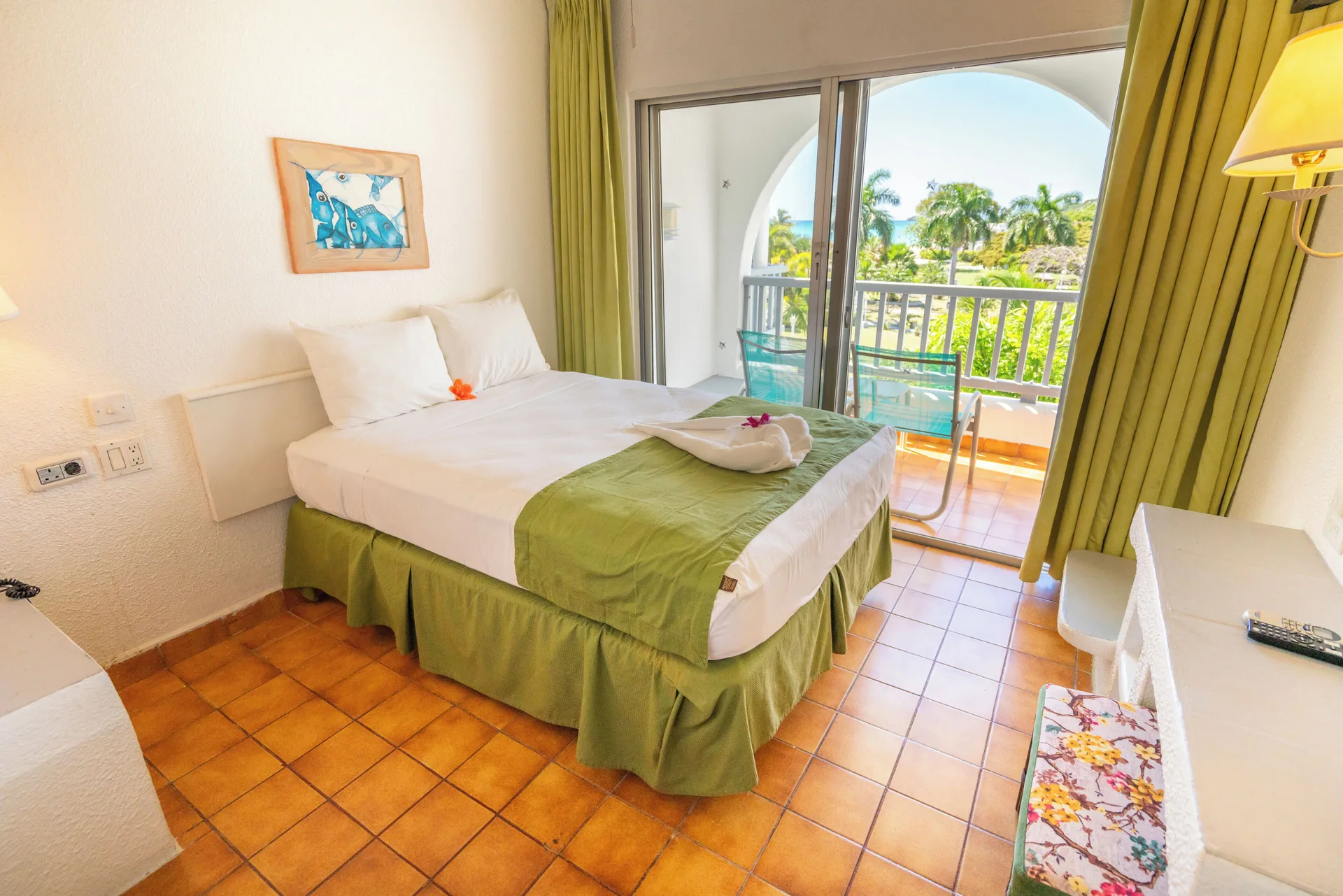 Super Saver Room with double bed and balcony at Jolly Beach Antigua.