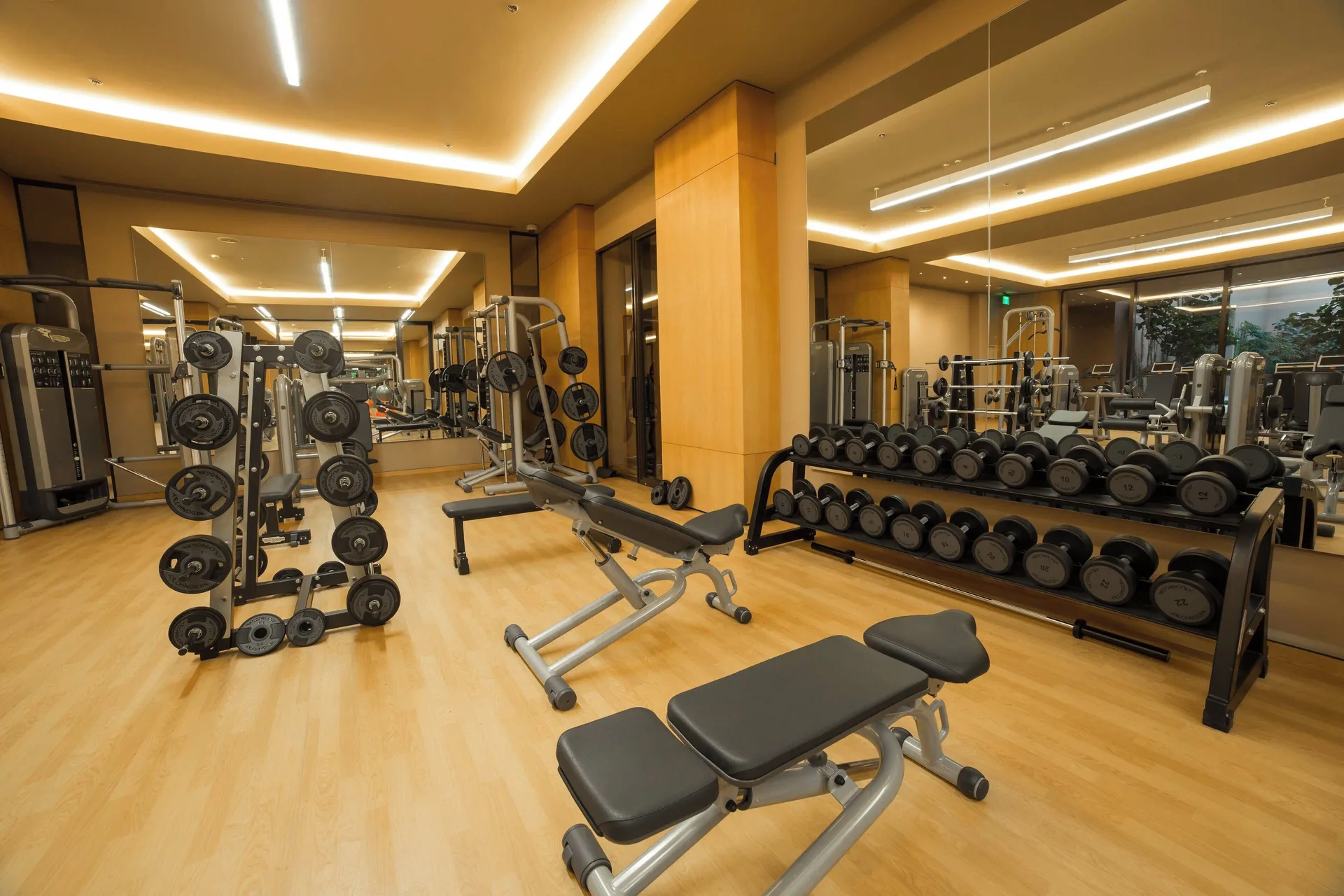 Free weights, benches and mirrors in the gym at JW Marriott Los Cabos Beach Resort & Spa.