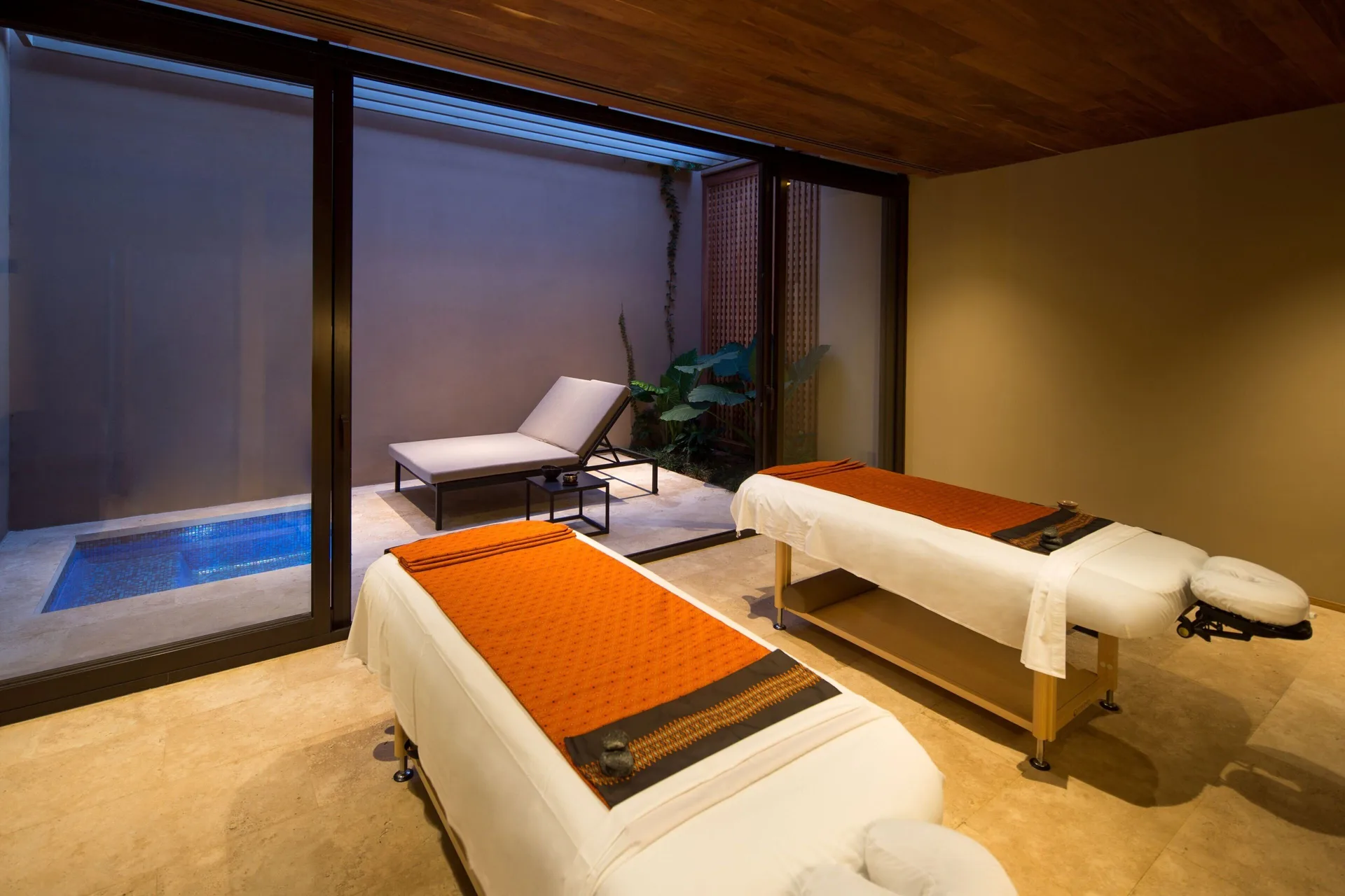 Spa treatment beds opening to a private patio at JW Marriott Los Cabos Beach Resort & Spa.