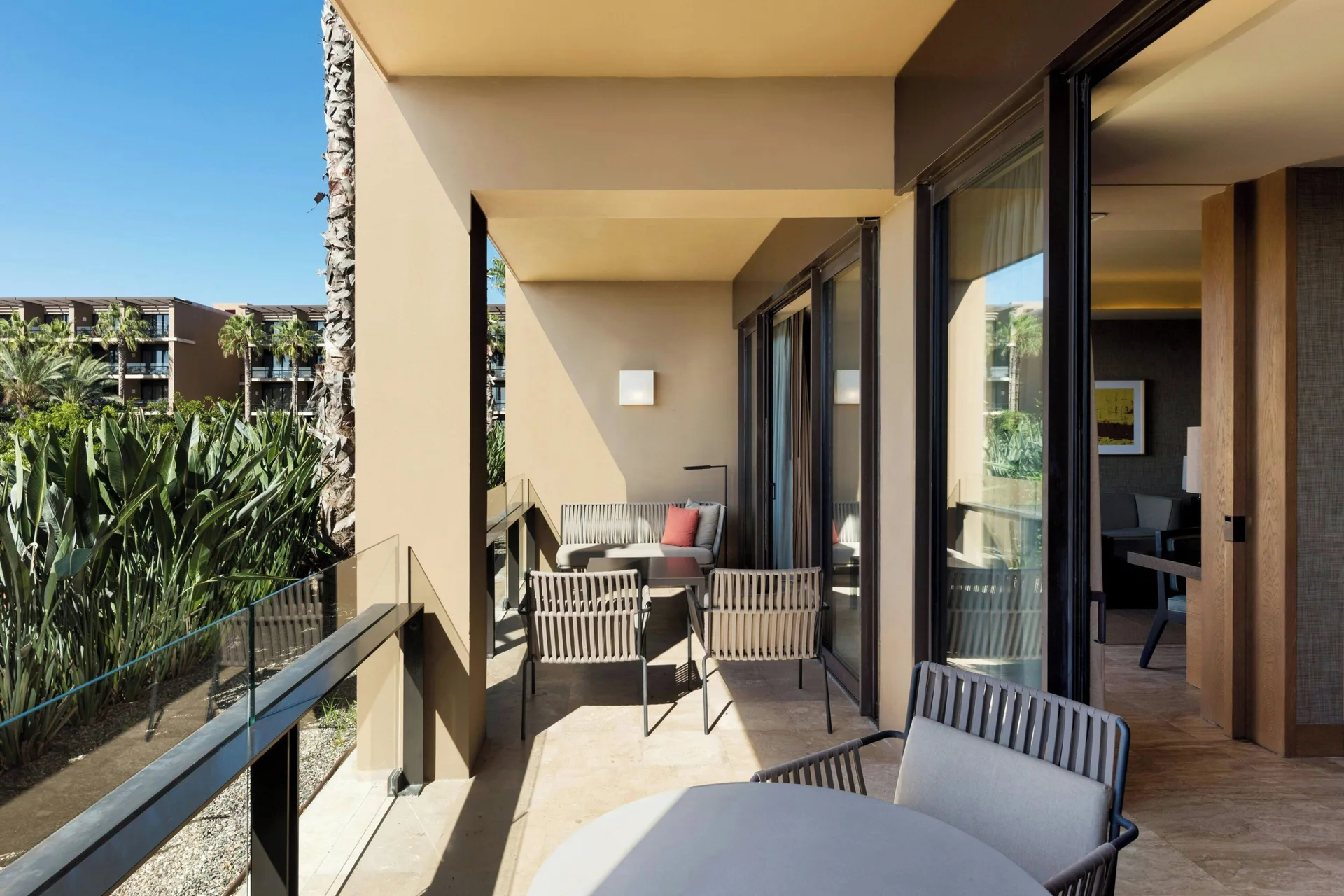 Furnished resort-view balcony of a Luxury Suite at JW Marriott Los Cabos Beach Resort & Spa.